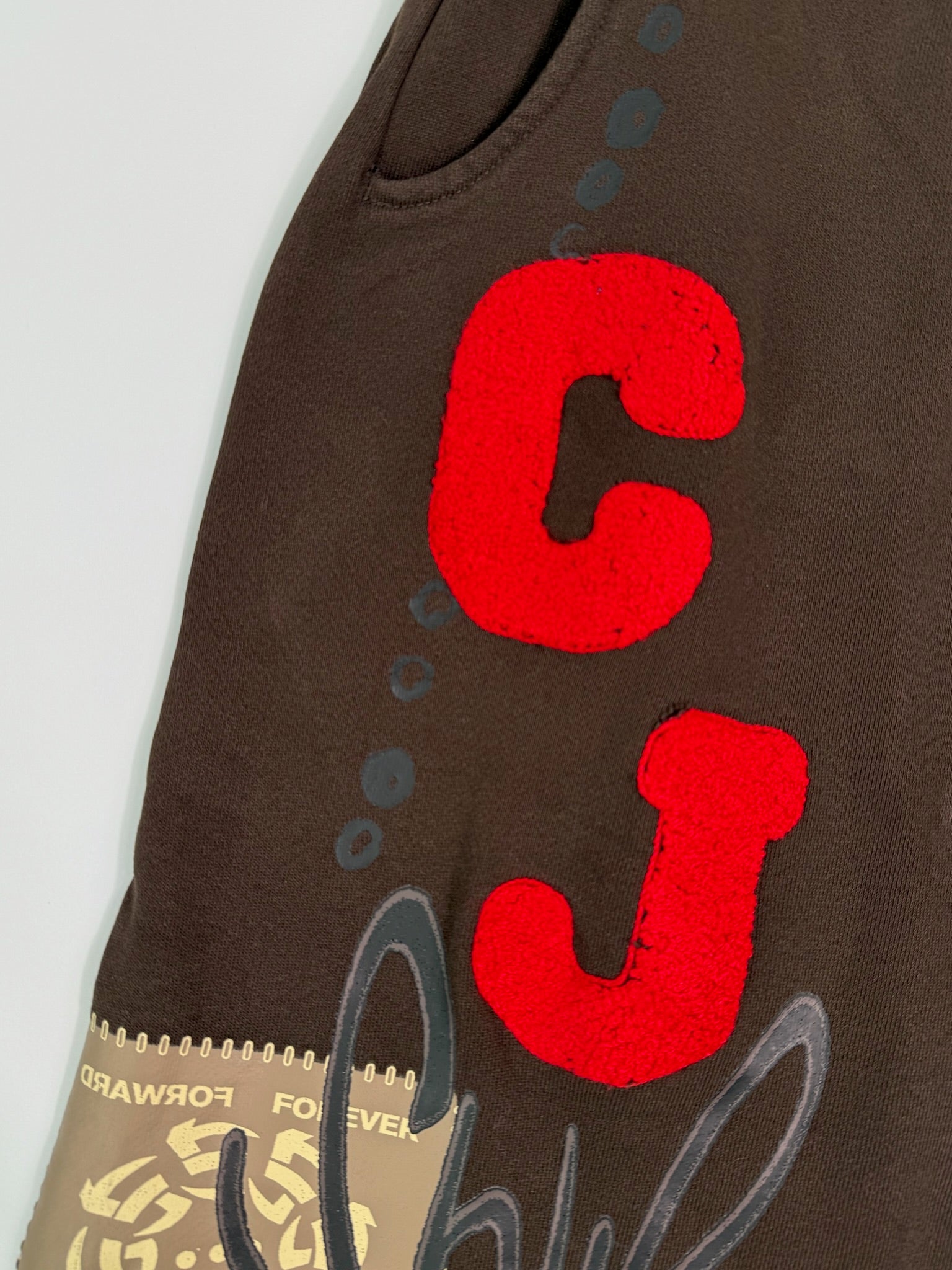 Pantaloni Marroni Travis Scott Flare Con Stampa E Dettagli Grafici