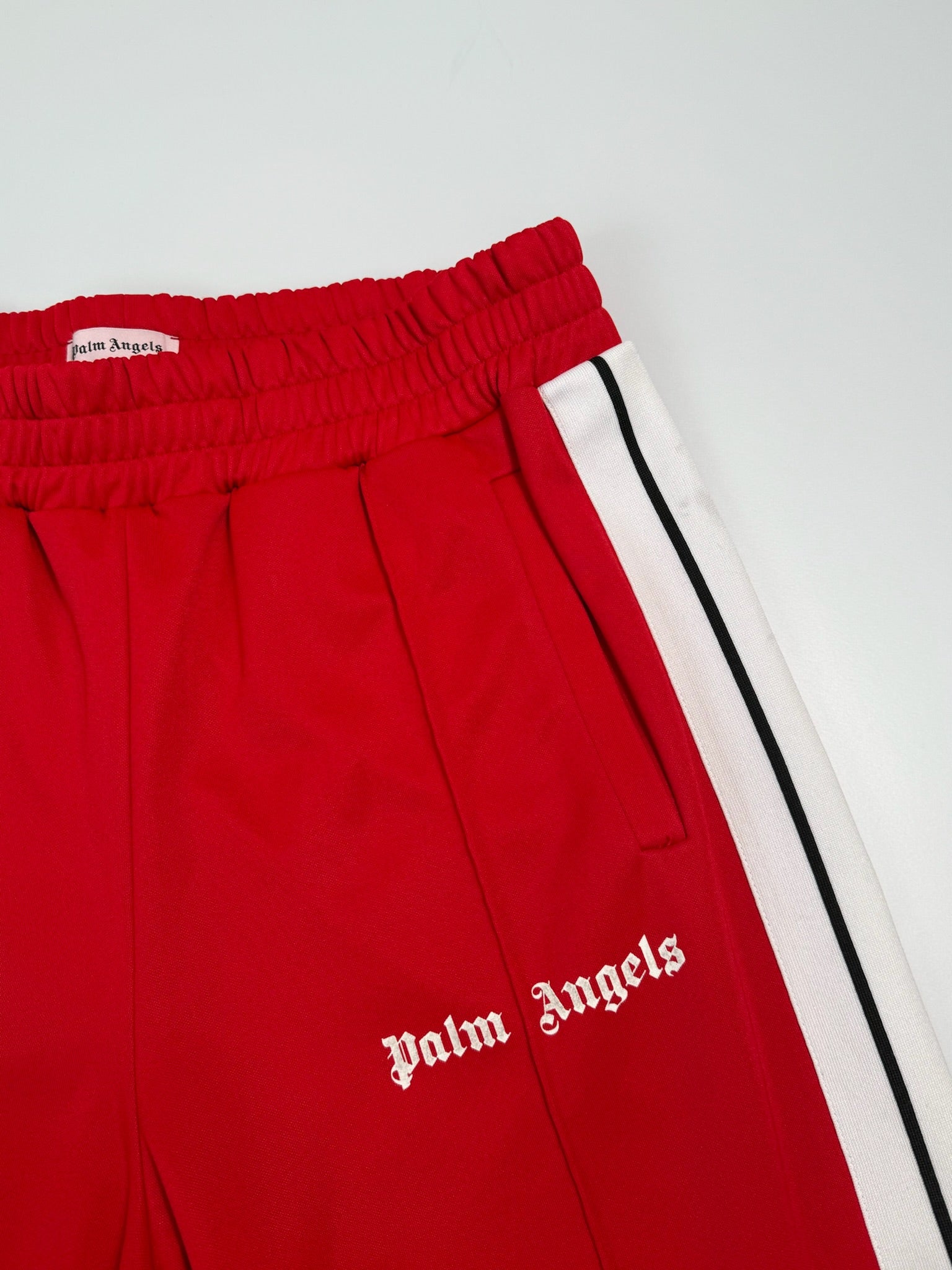 Red Pants With Side Stripes And Printed Logo