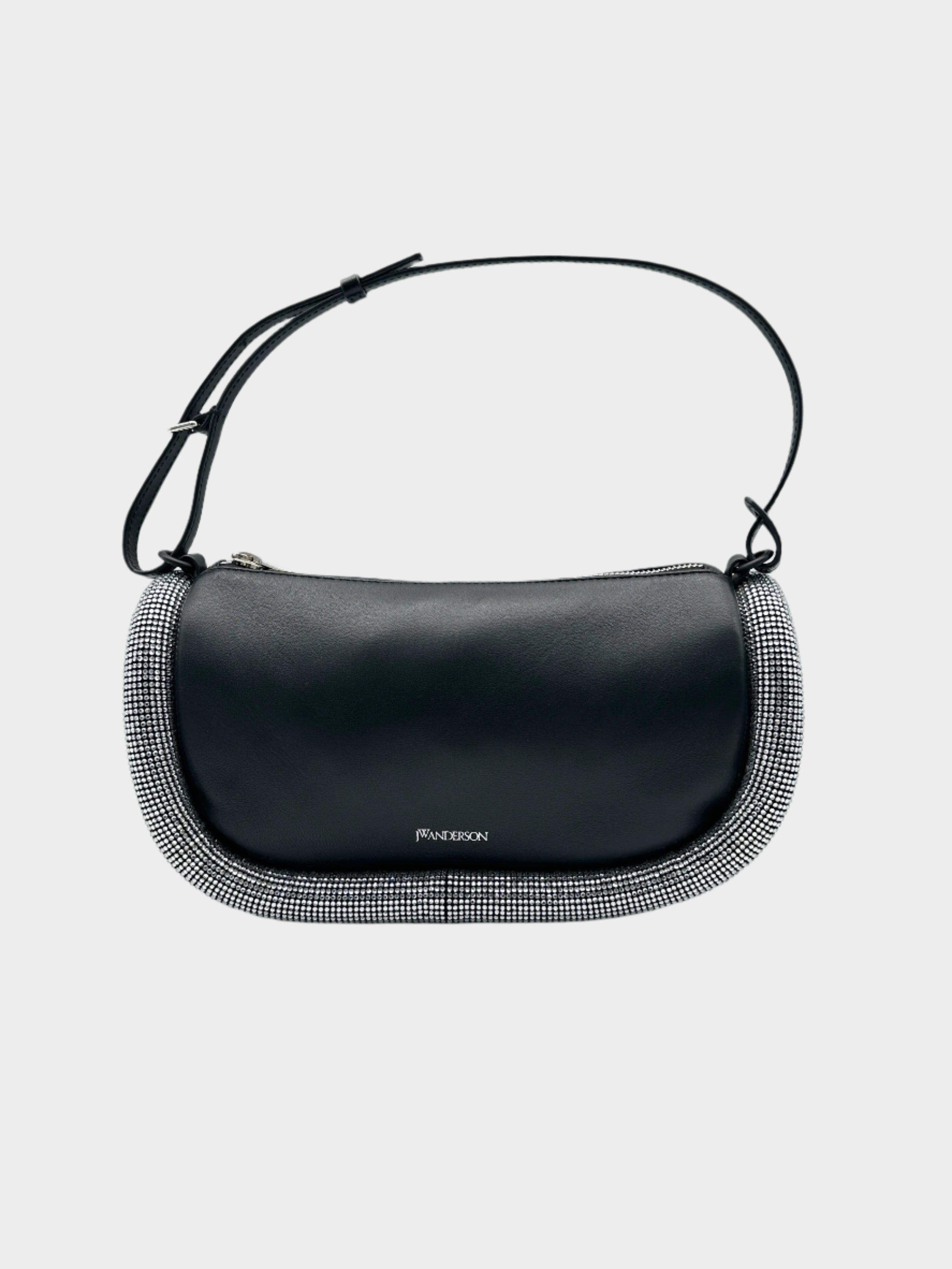 Borsa JW Anderson Bumper in pelle nera con bordo decorato in cristalli. Design elegante con tracolla regolabile e chiusura con zip.