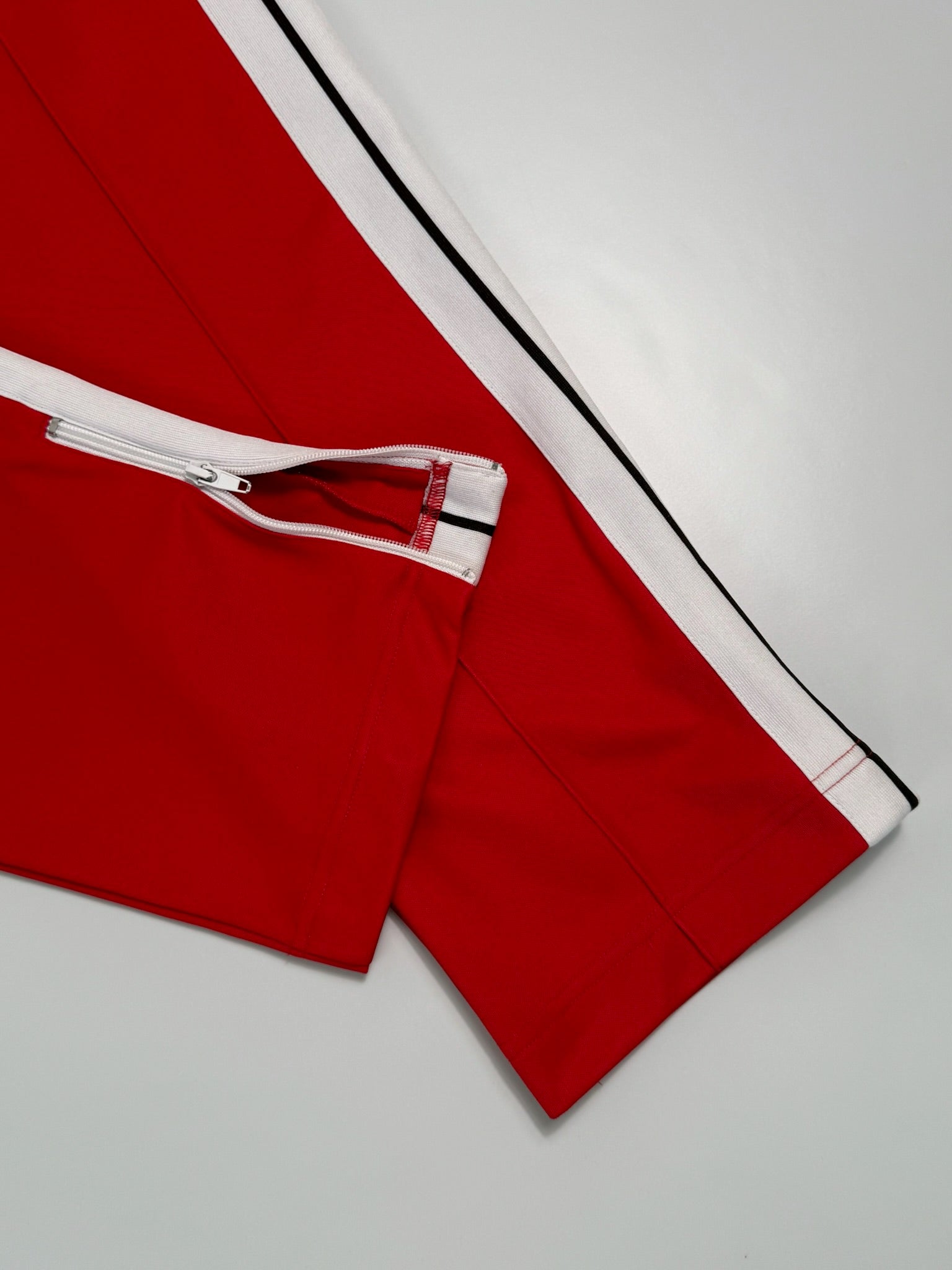 Red Pants With Side Stripes And Printed Logo