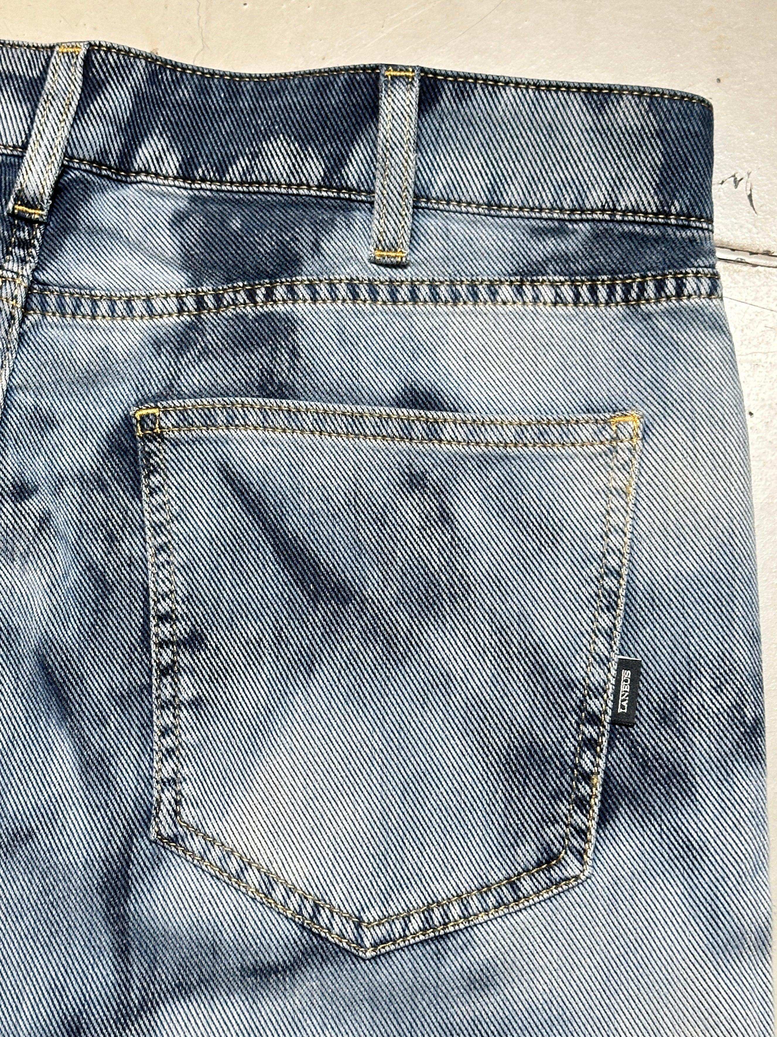 Faded Effect Jeans with Frayed Hems
