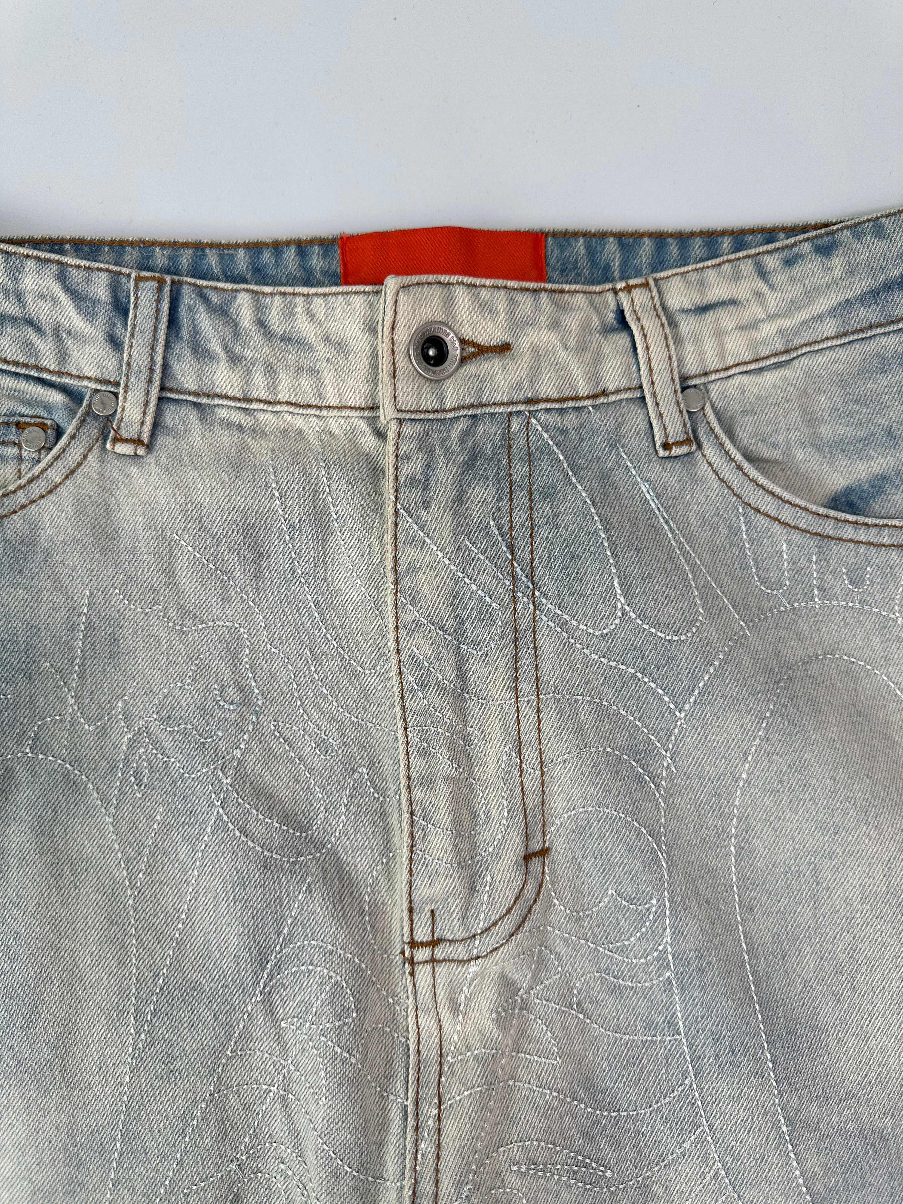Light Denim Jeans With Scratched Effect