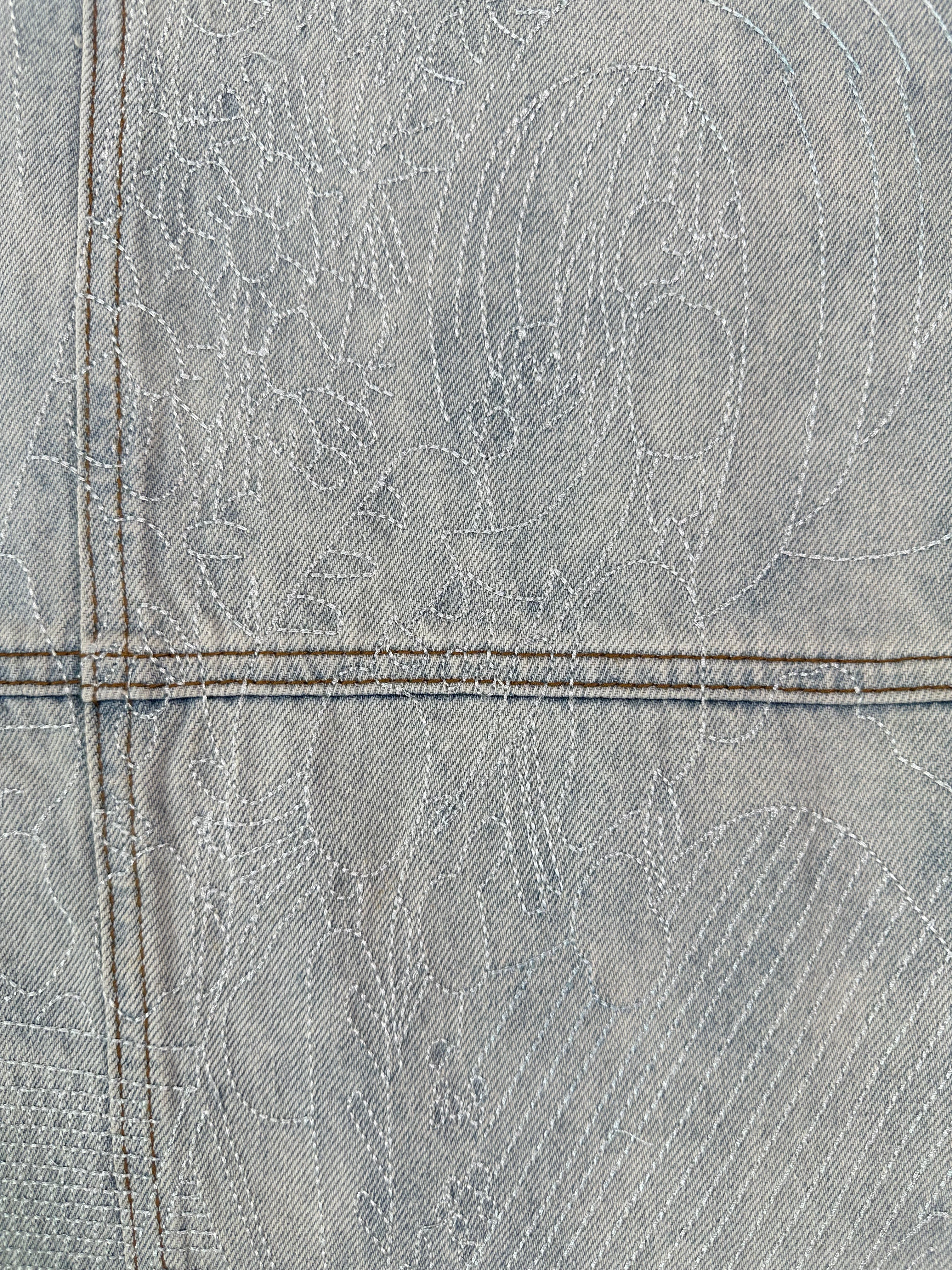 Light Denim Jeans With Scratched Effect