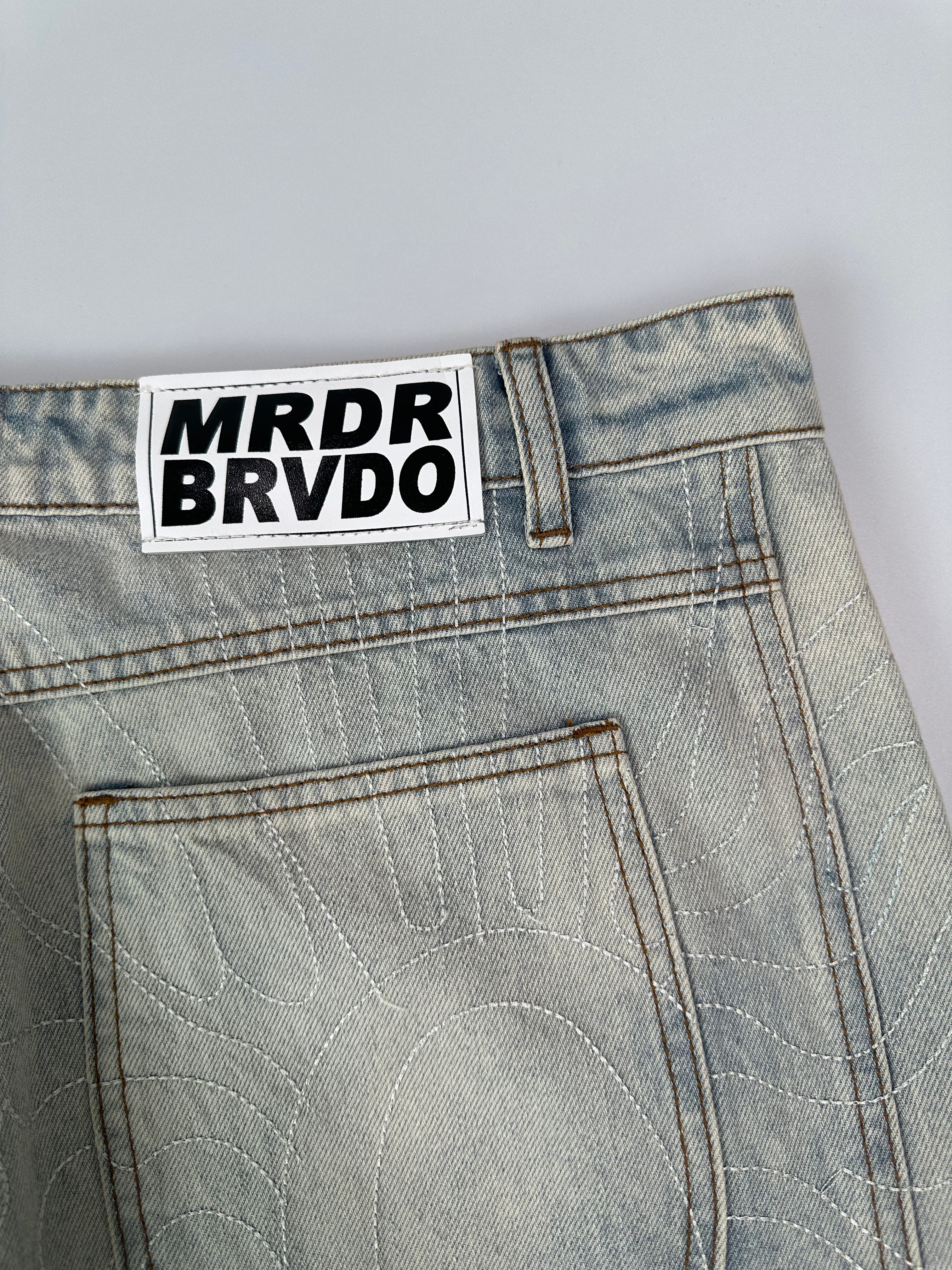 Light Denim Jeans With Scratched Effect