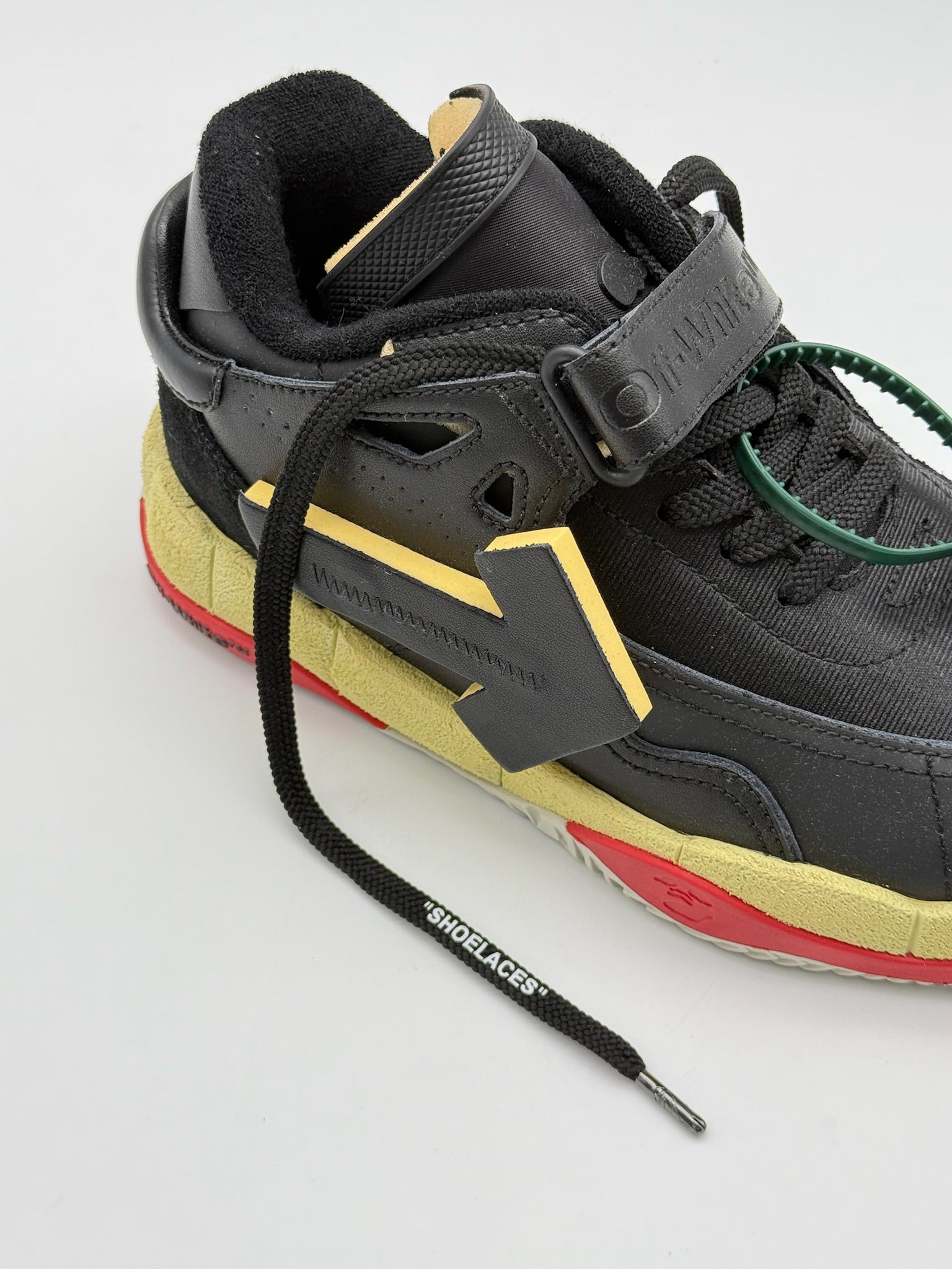 Black Low Top Puzzle Couture Sneakers