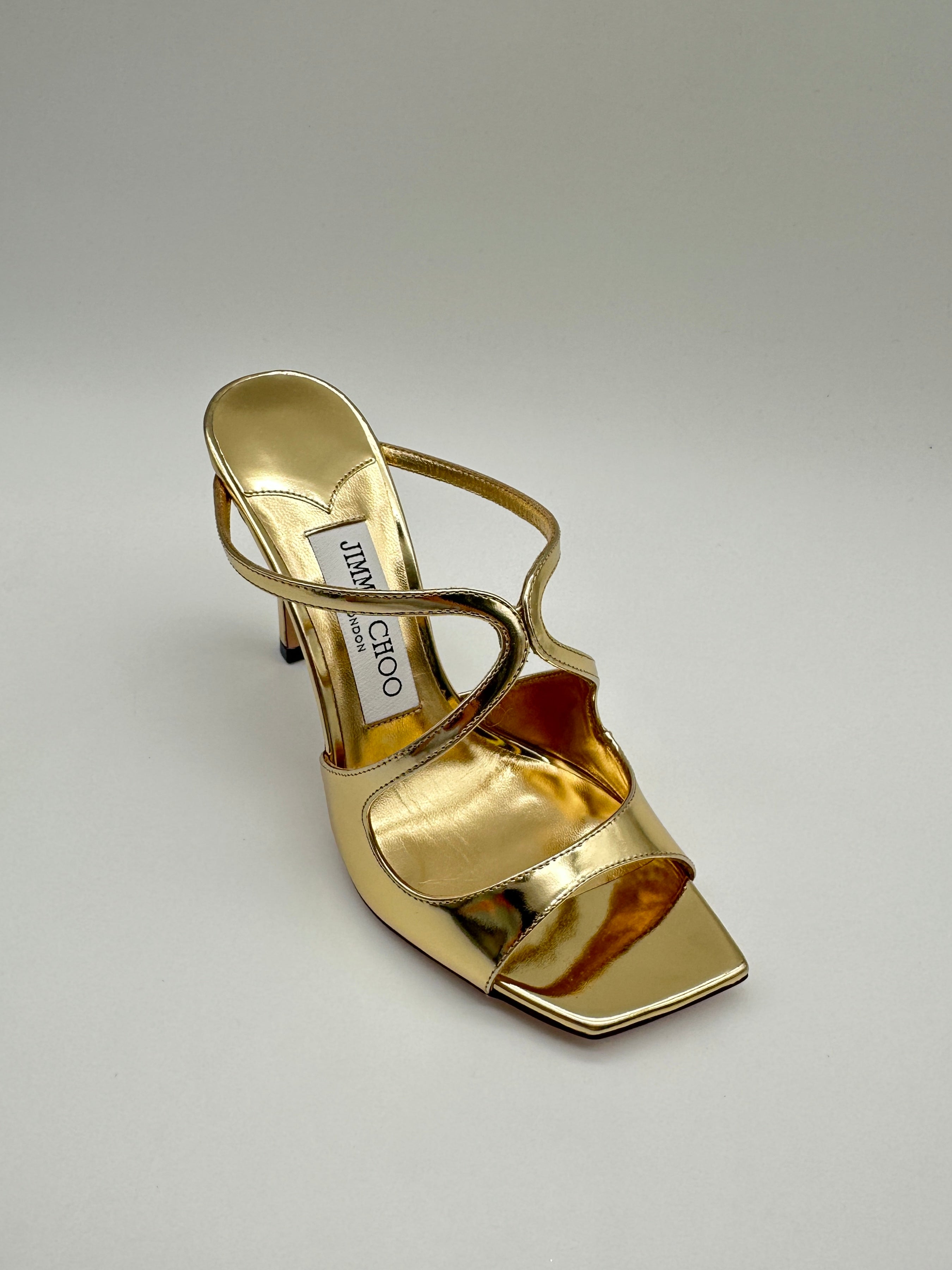 Gold Liquid Metal Leather Mules con punta squadrata, effetto metallo liquido e tacco a stiletto da 9 cm.