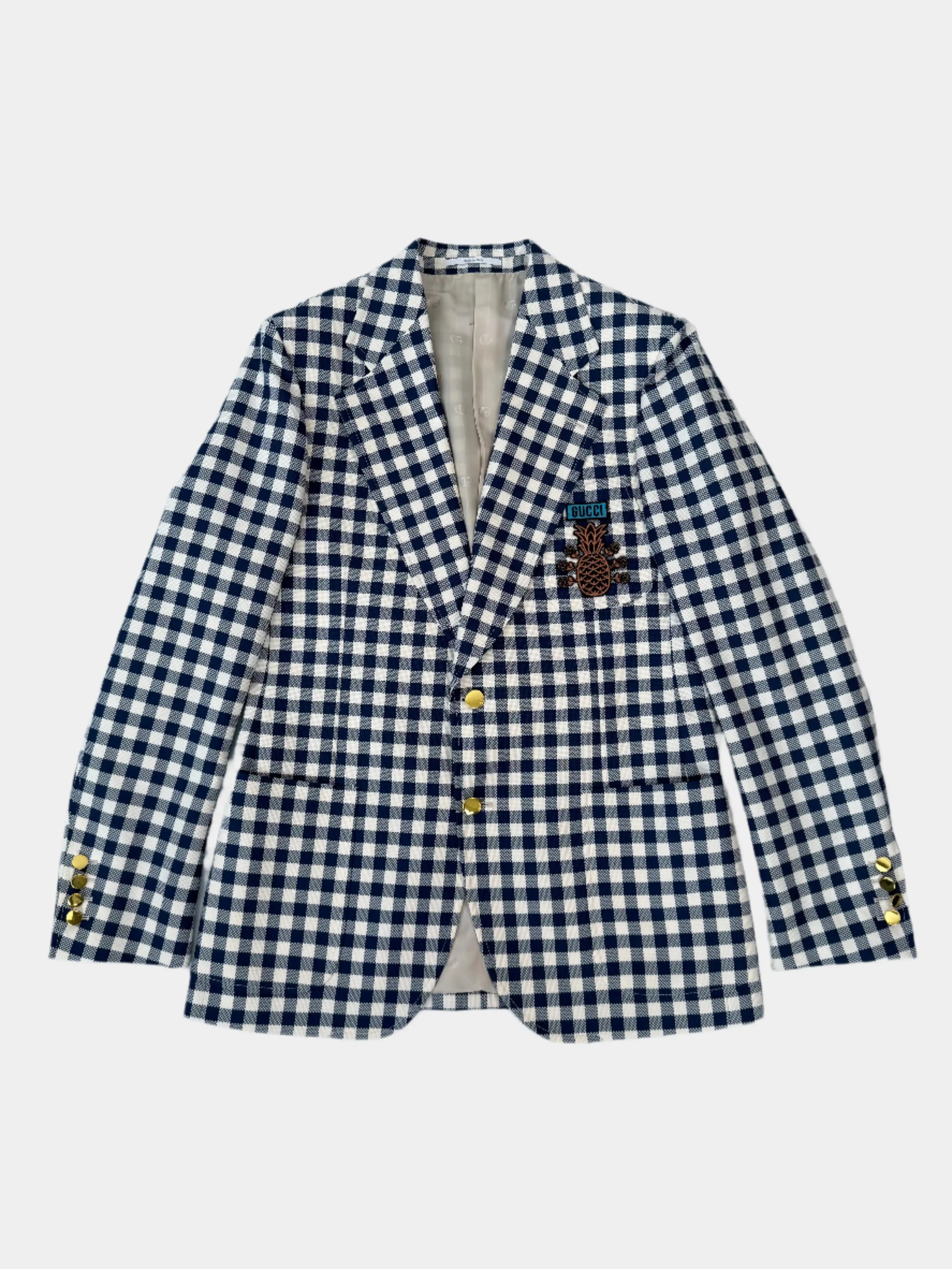 Blazer Gucci a quadretti con patch ananas visto frontalmente