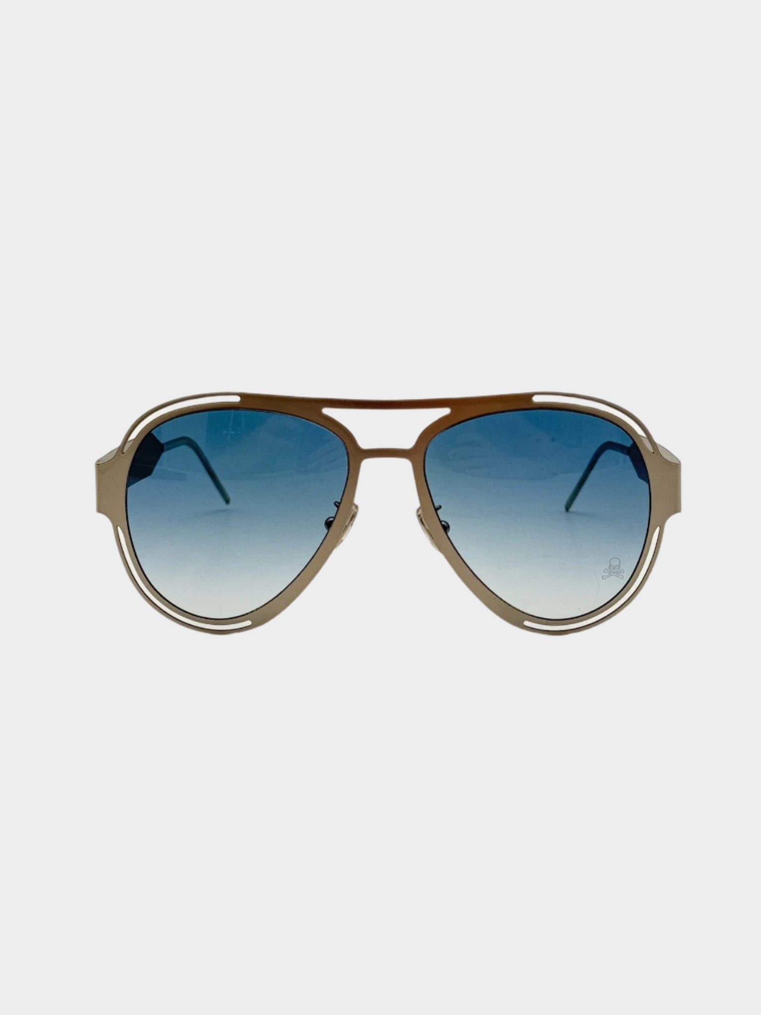 Occhiali da sole Philipp Plein con montatura chiara e lenti azzurre sfumate vista frontale