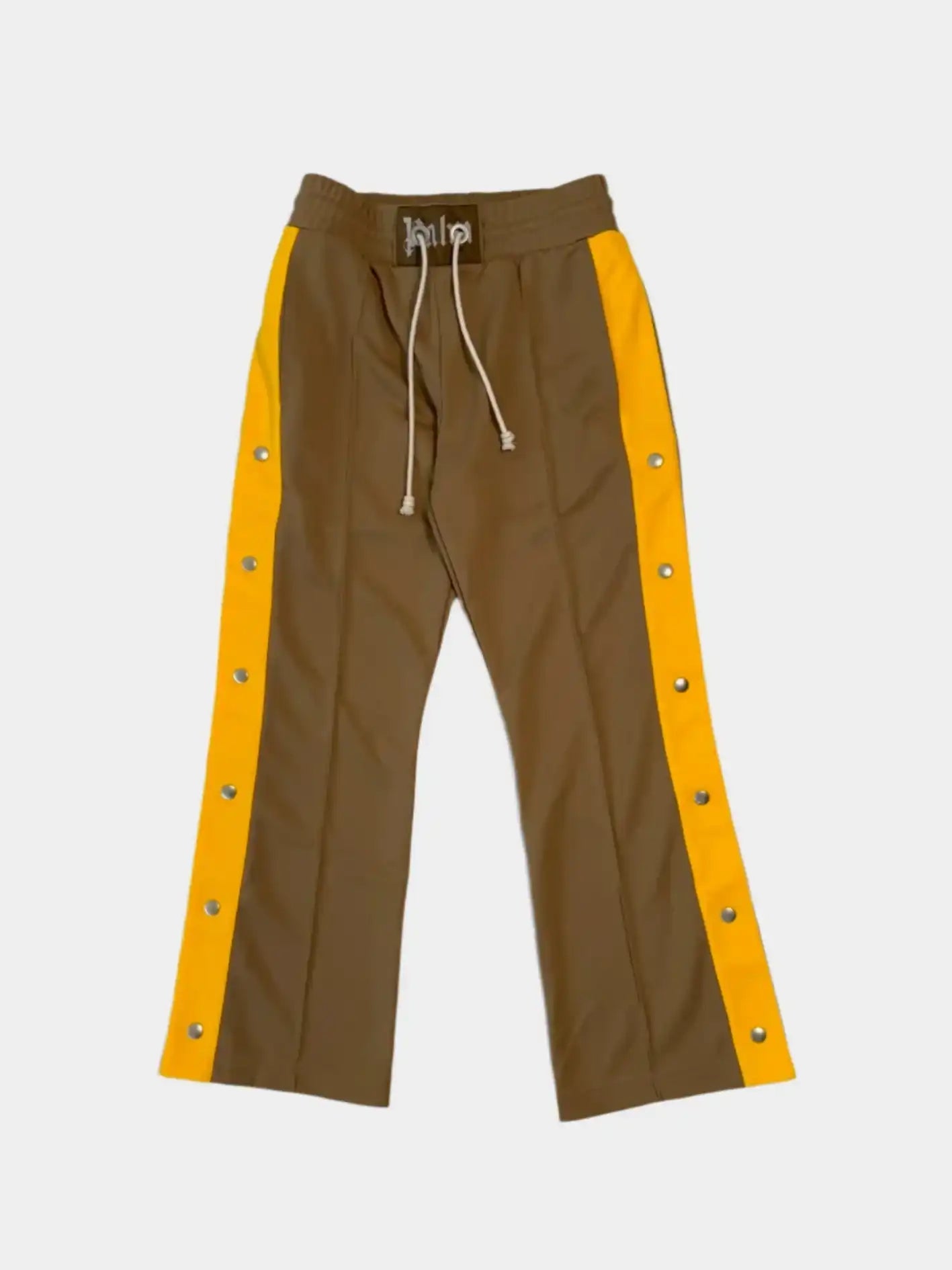 Vista frontale dei pantaloni Palm Angels beige con bande gialle e bottoni
