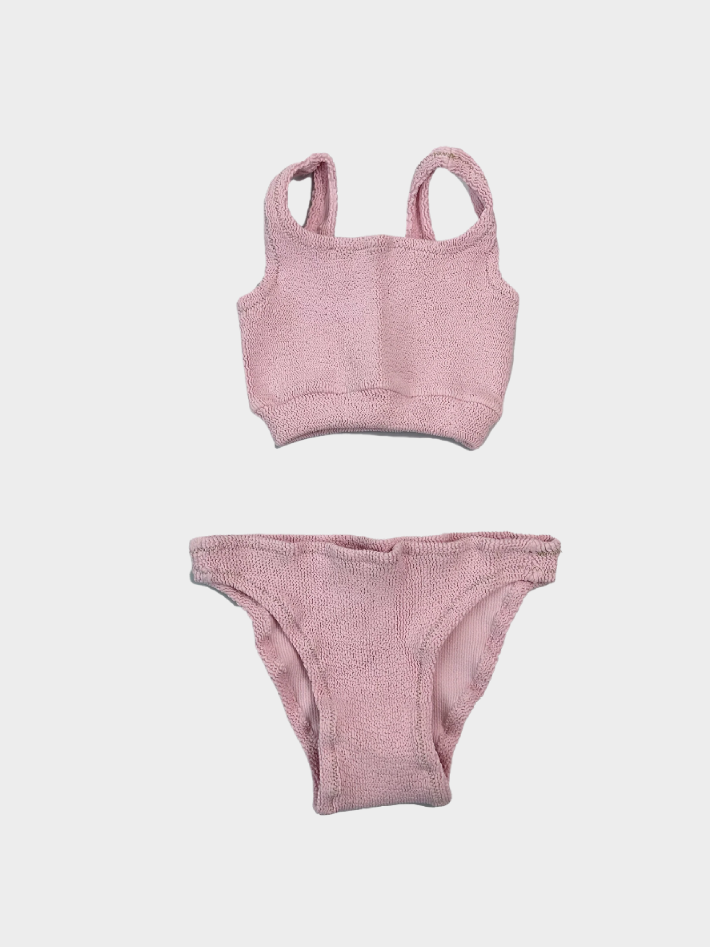 Vista frontale del costume intero rosa da bambina Reina Olga