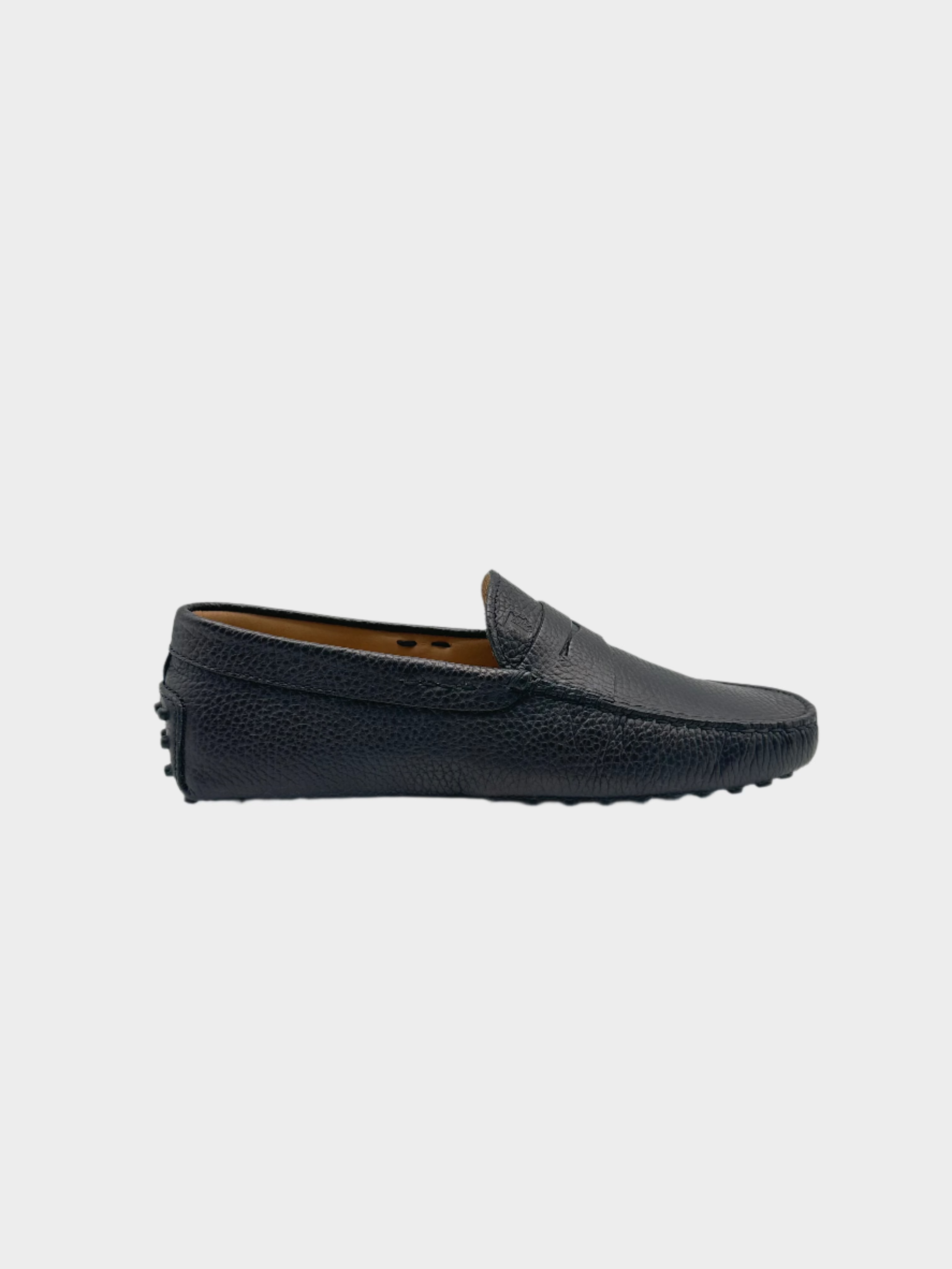 Mocassino Tod's in pelle martellata nera con suola a gommini, vista laterale