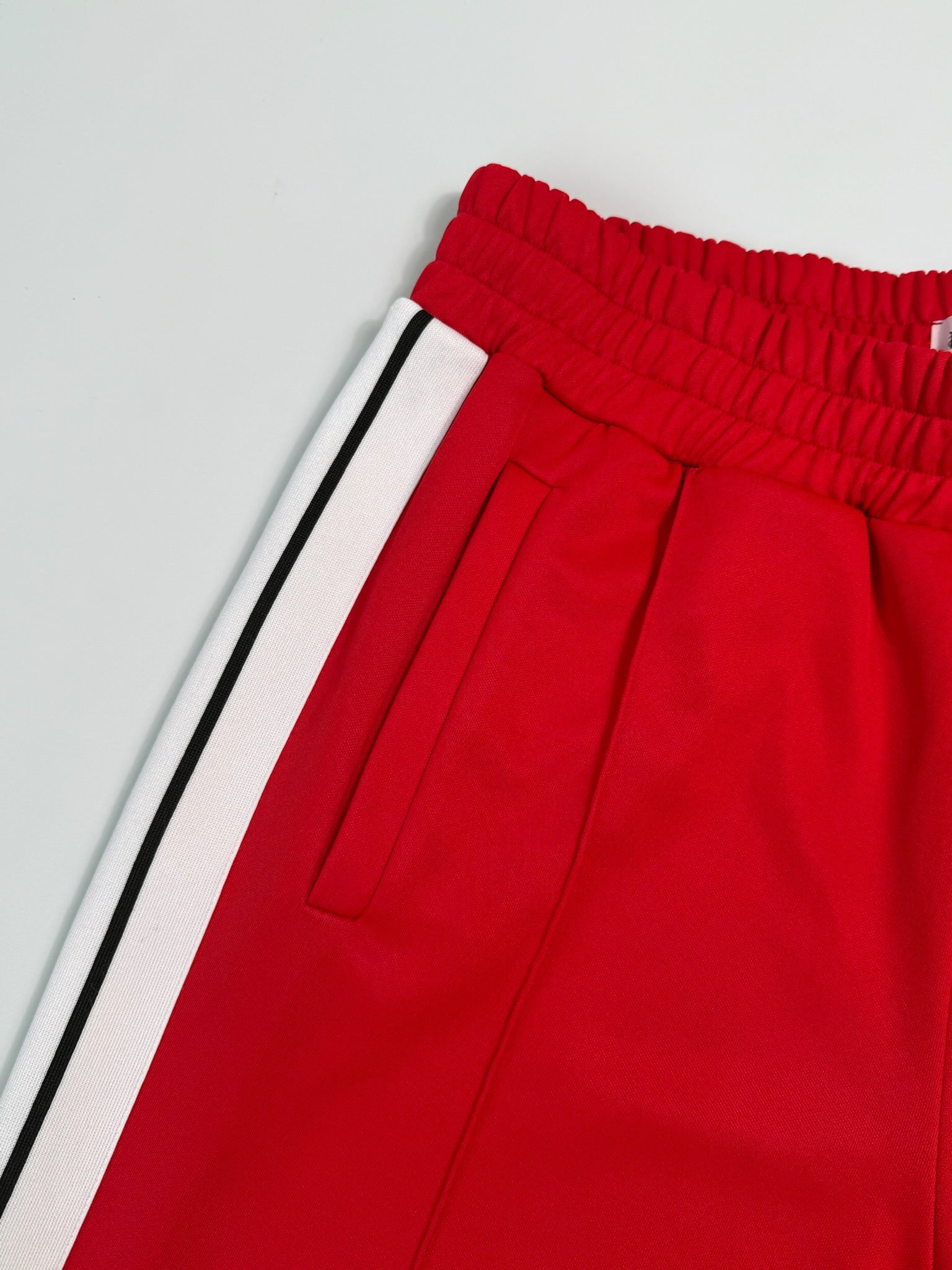 Red Pants With Side Stripes And Printed Logo