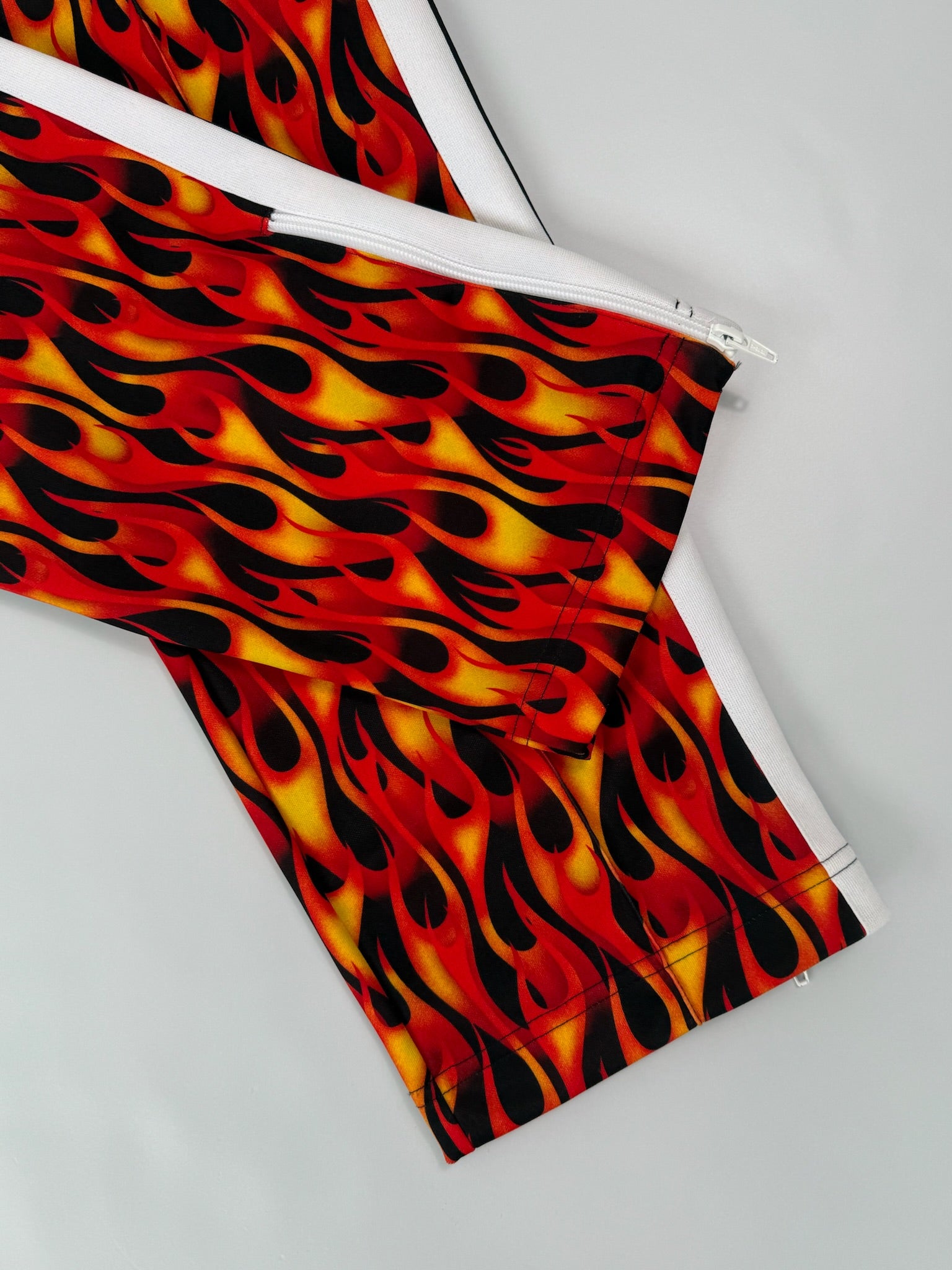 Pants With Flame Print And White Side Stripes