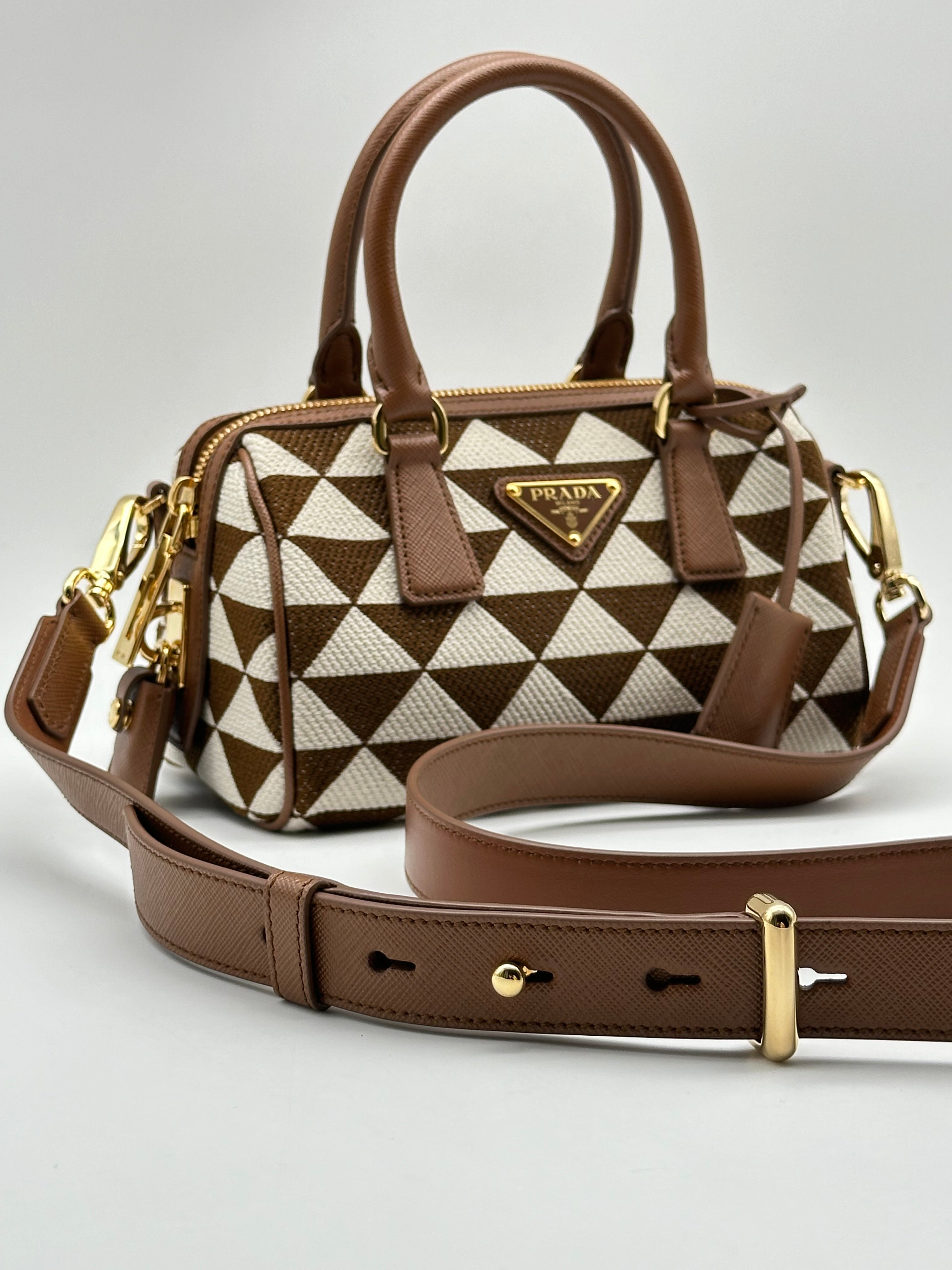 Symbol Saffiano Handbags