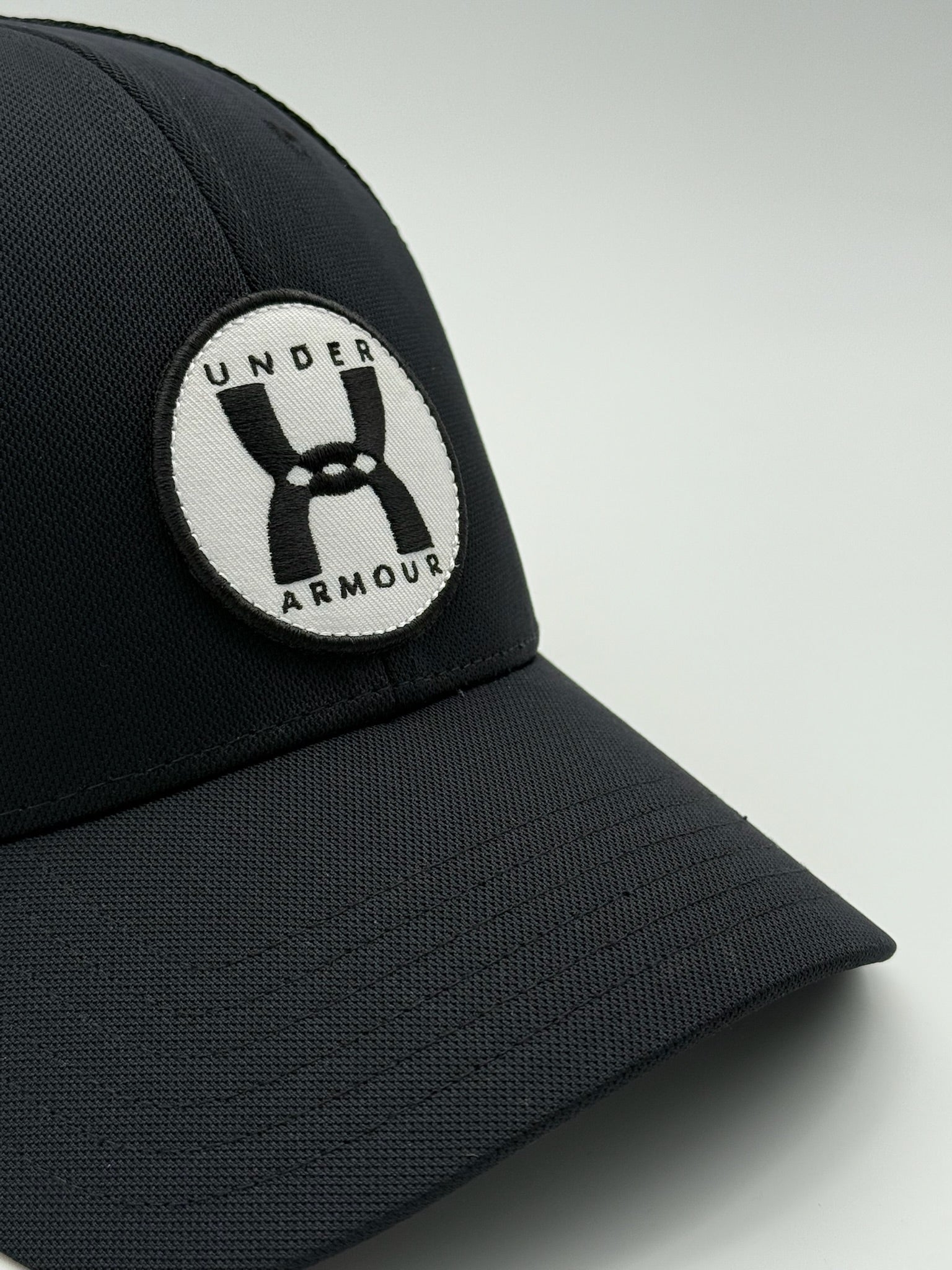 Black Trucker Hat With Embroidered Patch Logo