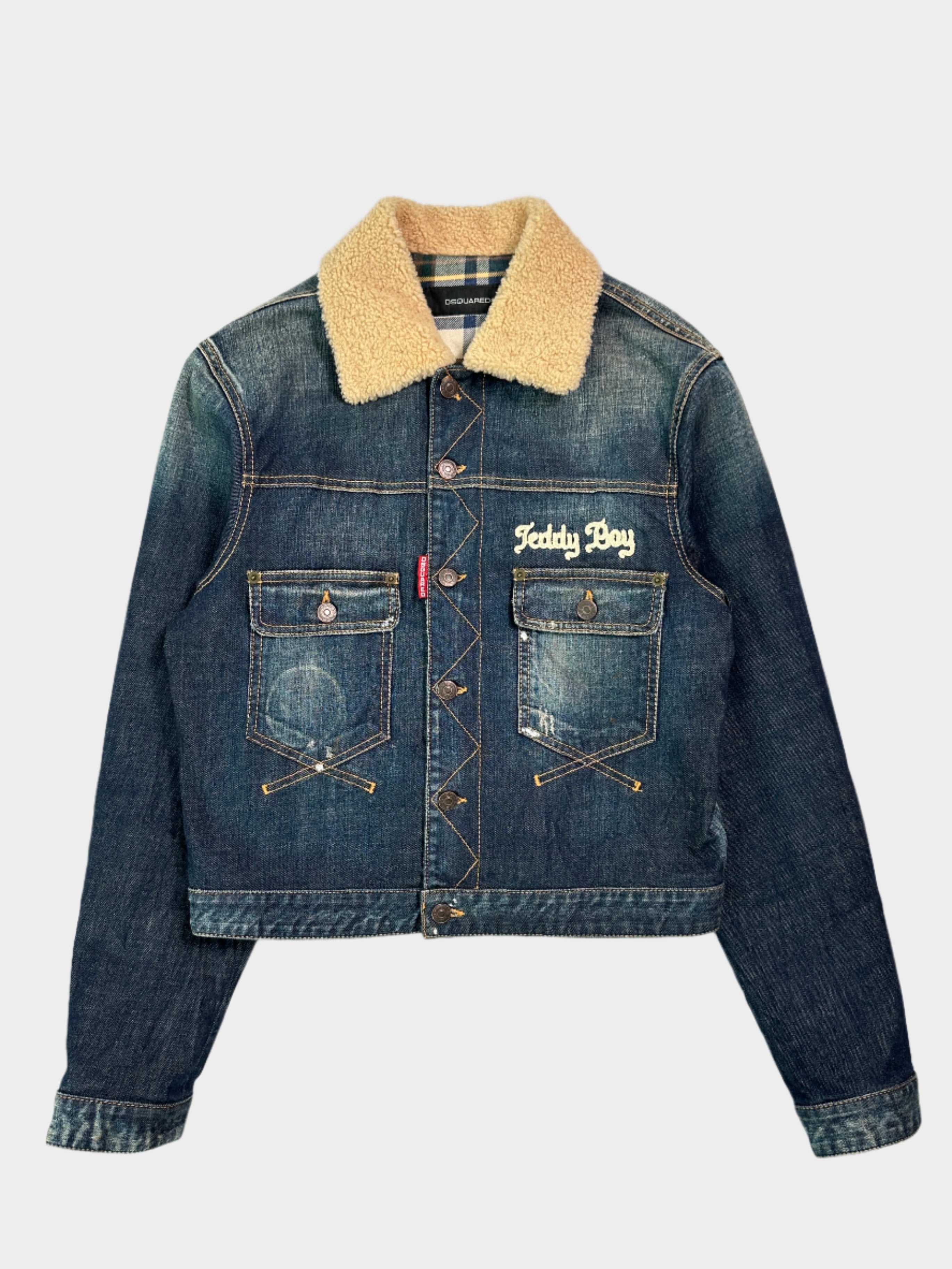 Scopri la giacca in denim Dsquared2 con colletto shearling. Stile vintage e dettagli unici per un look iconico.