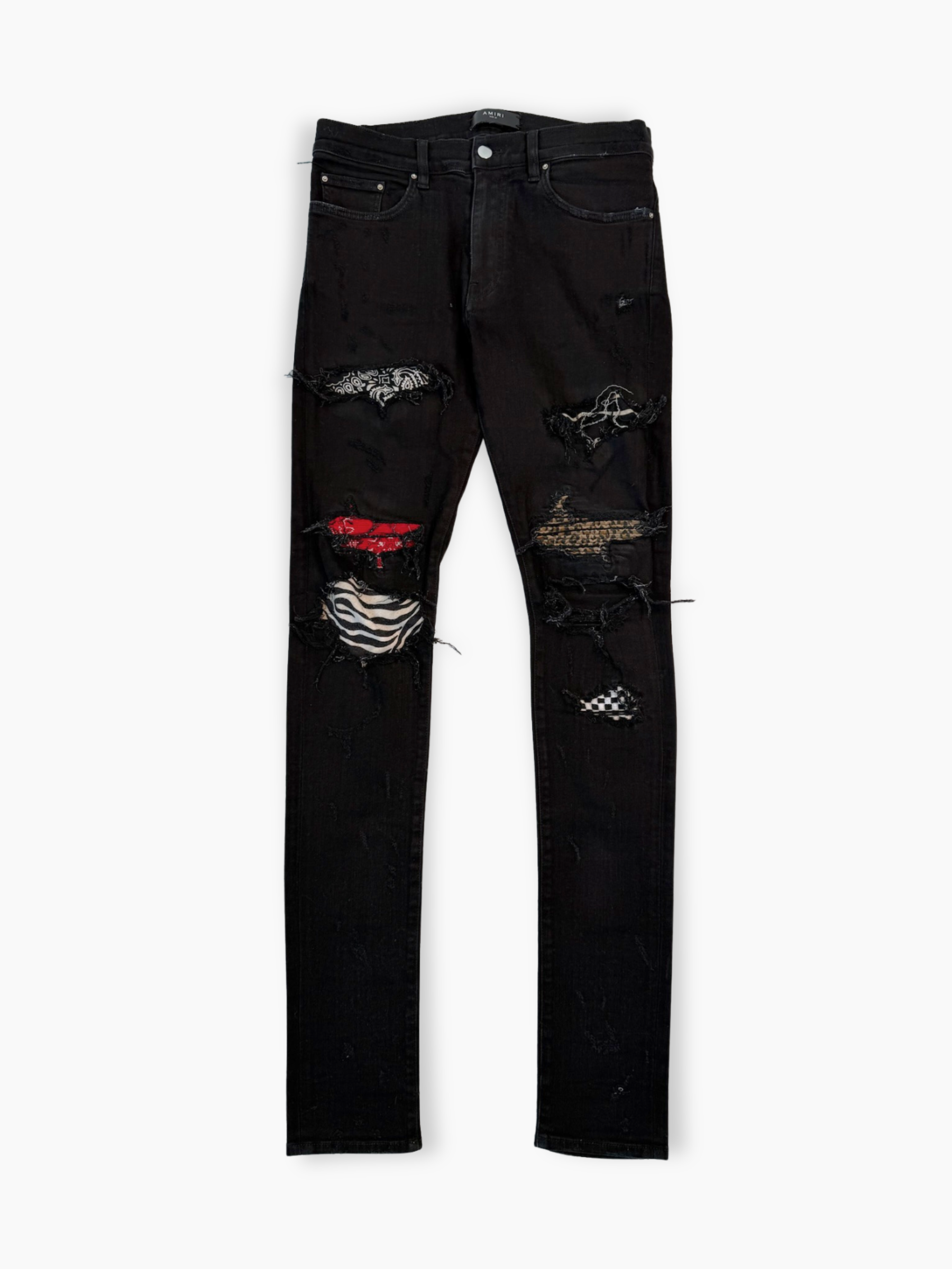 Jeans neri skinny Amiri con strappi e patch bandana multicolore