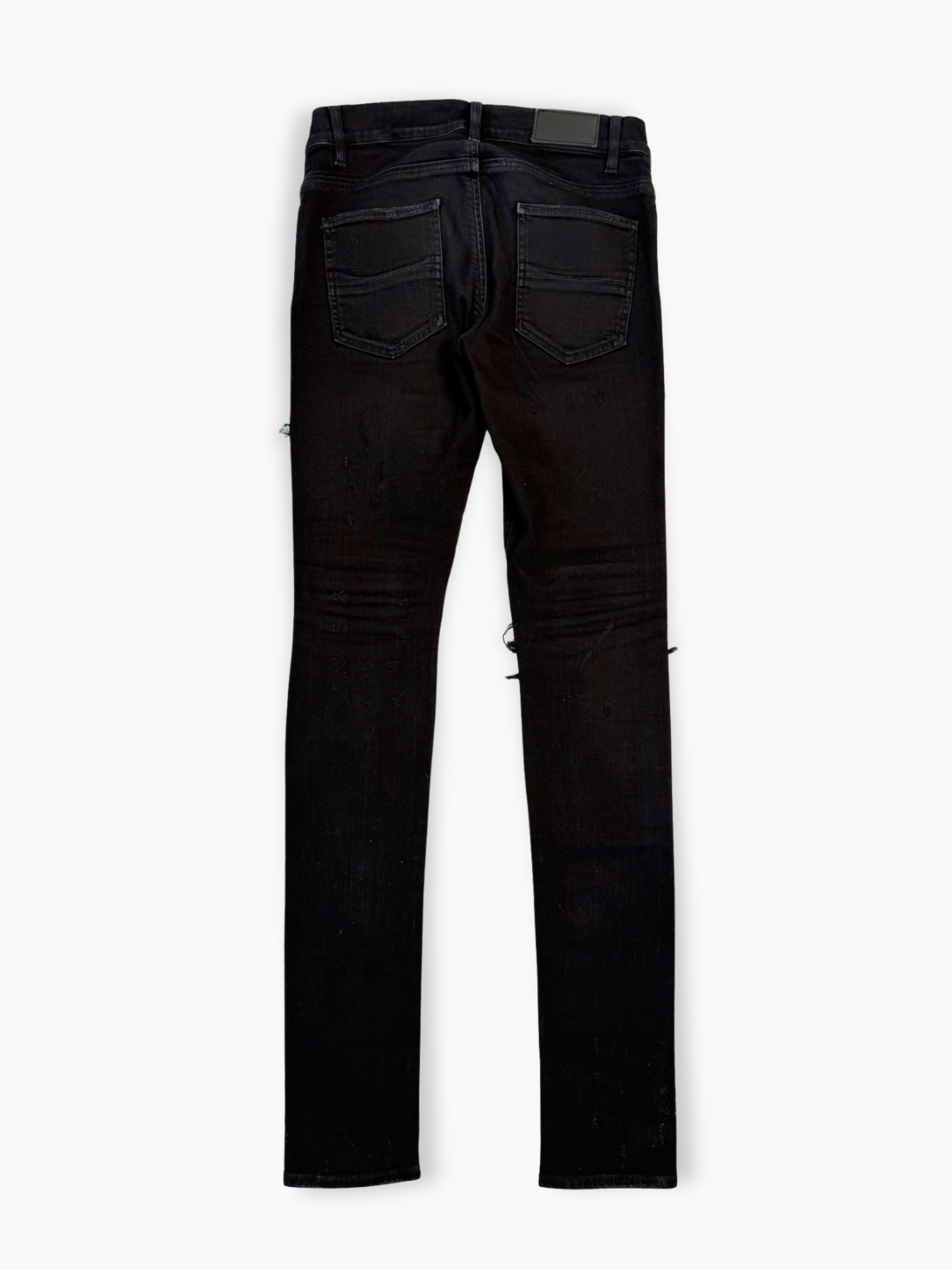 Jeans neri skinny Amiri con strappi e patch bandana multicolore