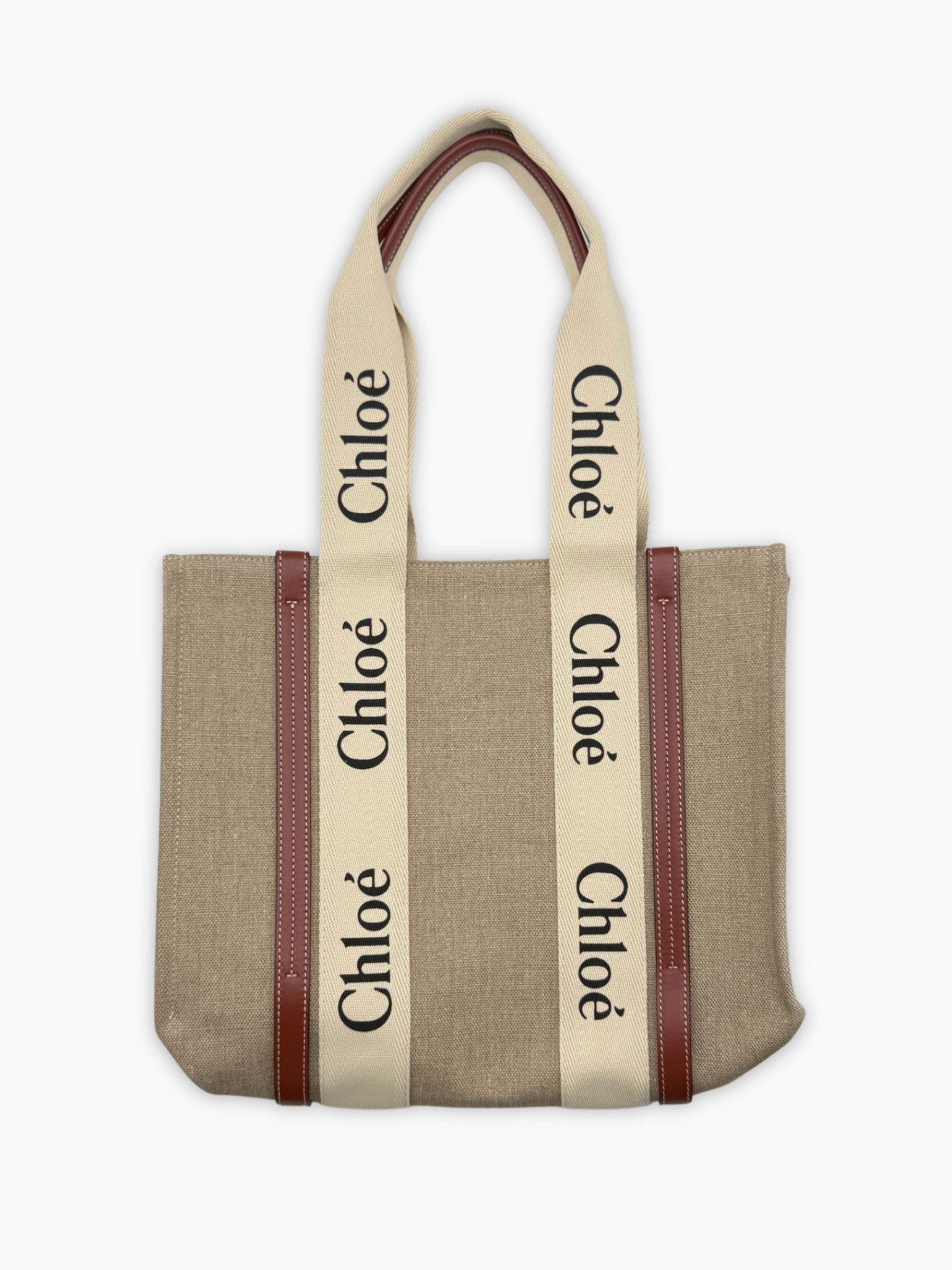 Borsa tote grande Chloé Woody in tela beige con manici logati vista frontale