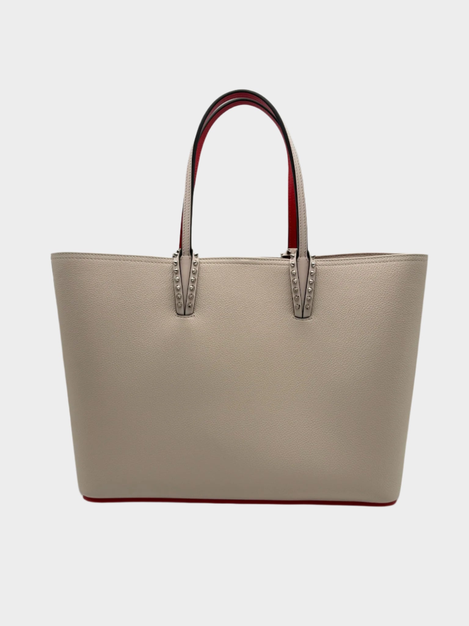 Borsa shopper Louboutin rosa in pelle martellata con borchie e interno rosso vista frontale