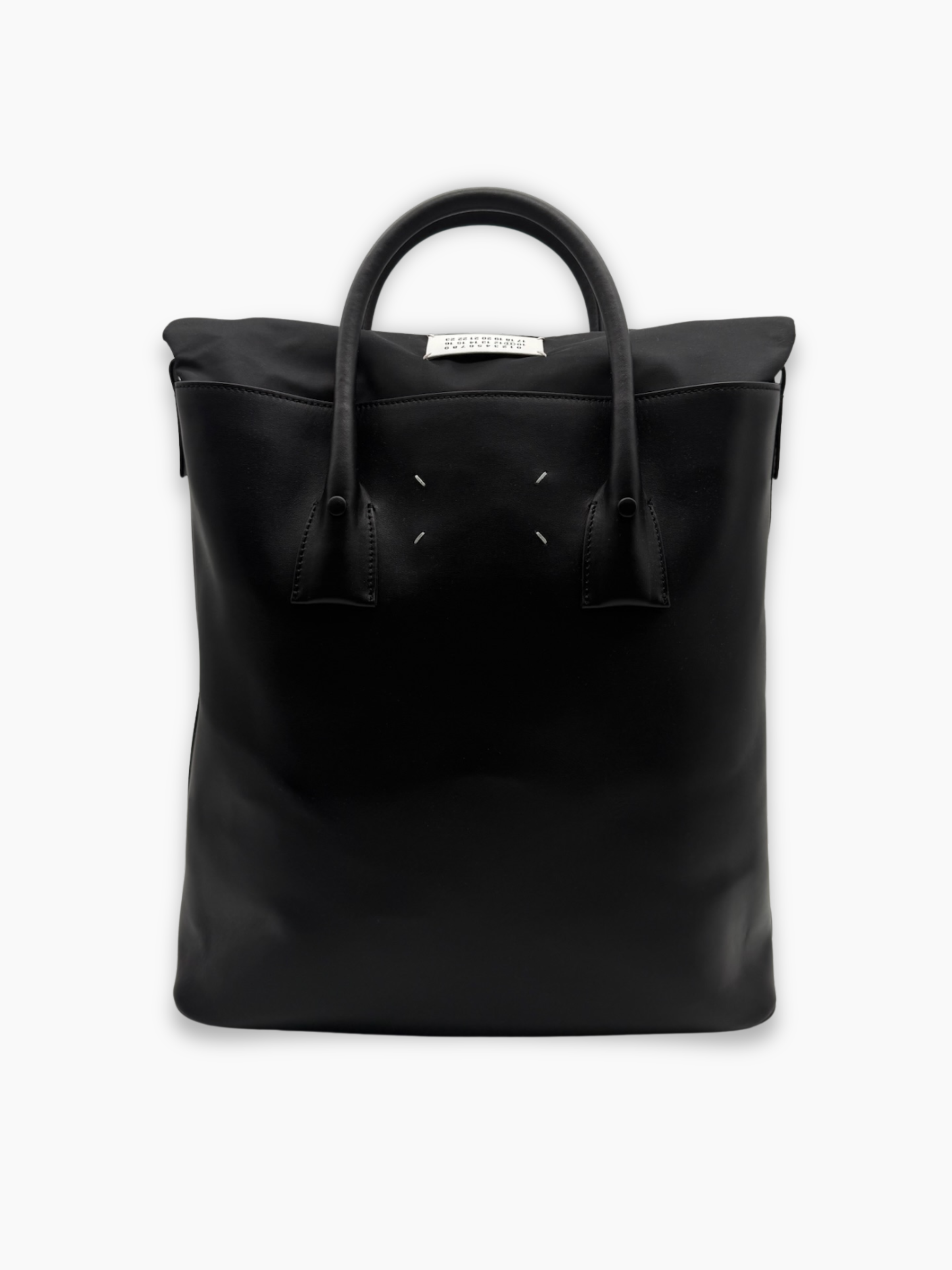 Retro della borsa nera Maison Margiela con quattro punti iconici