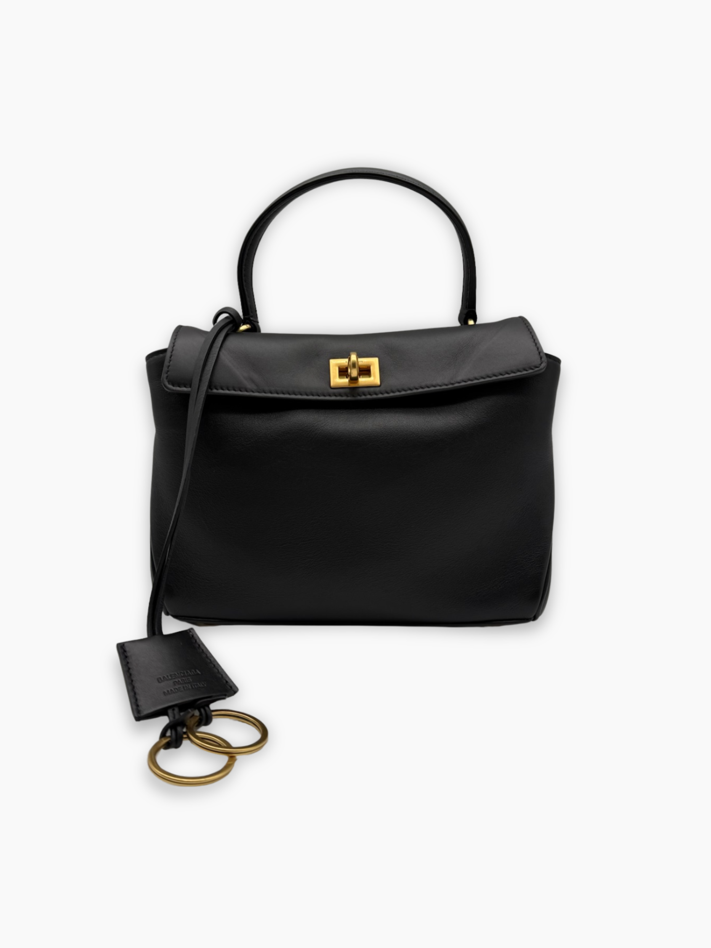 Borsa in pelle nera con manico rigido, chiusura dorata e charm decorativo