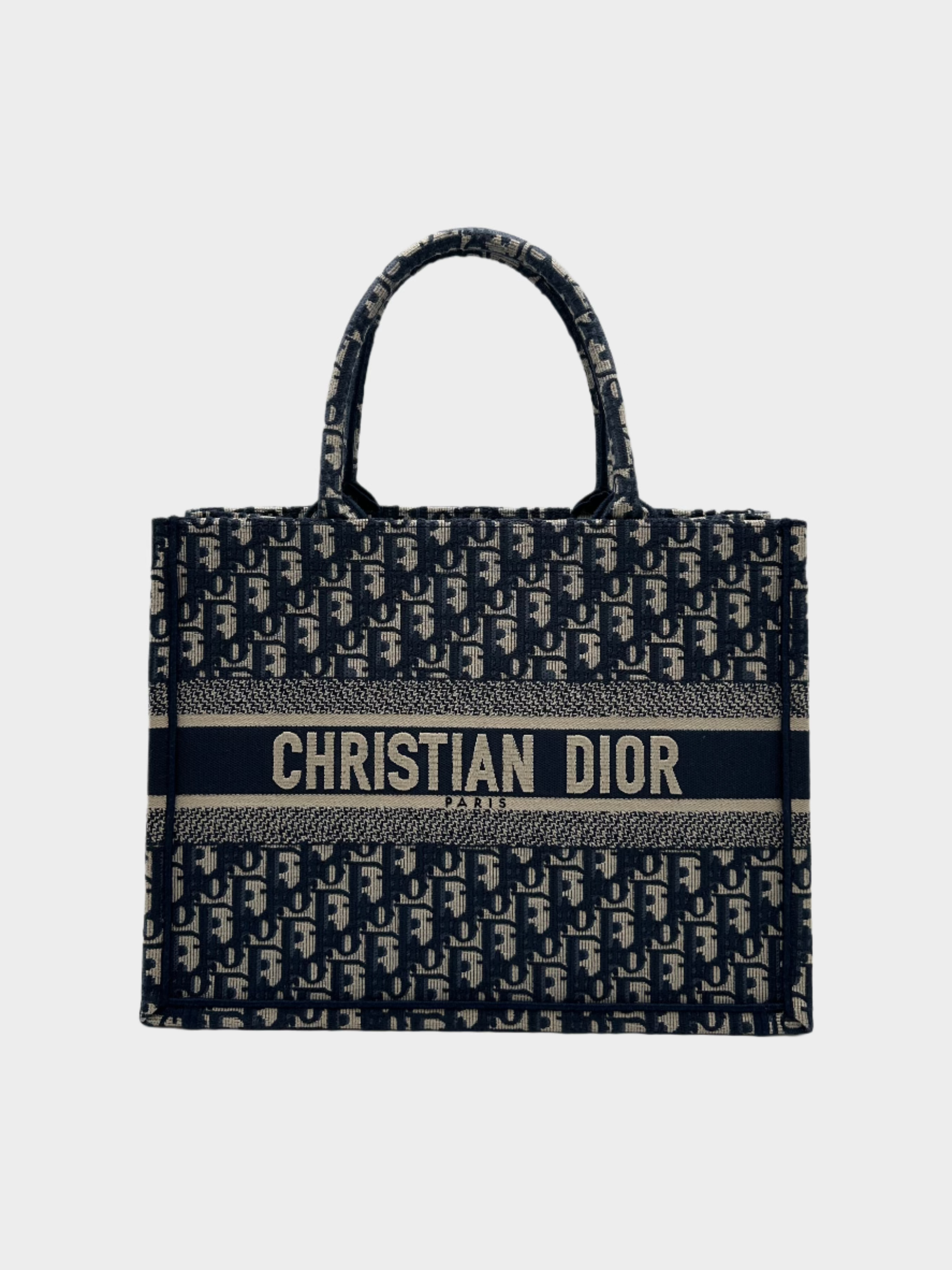 Vista frontale Dior Book Tote media con motivo Oblique écru e blu