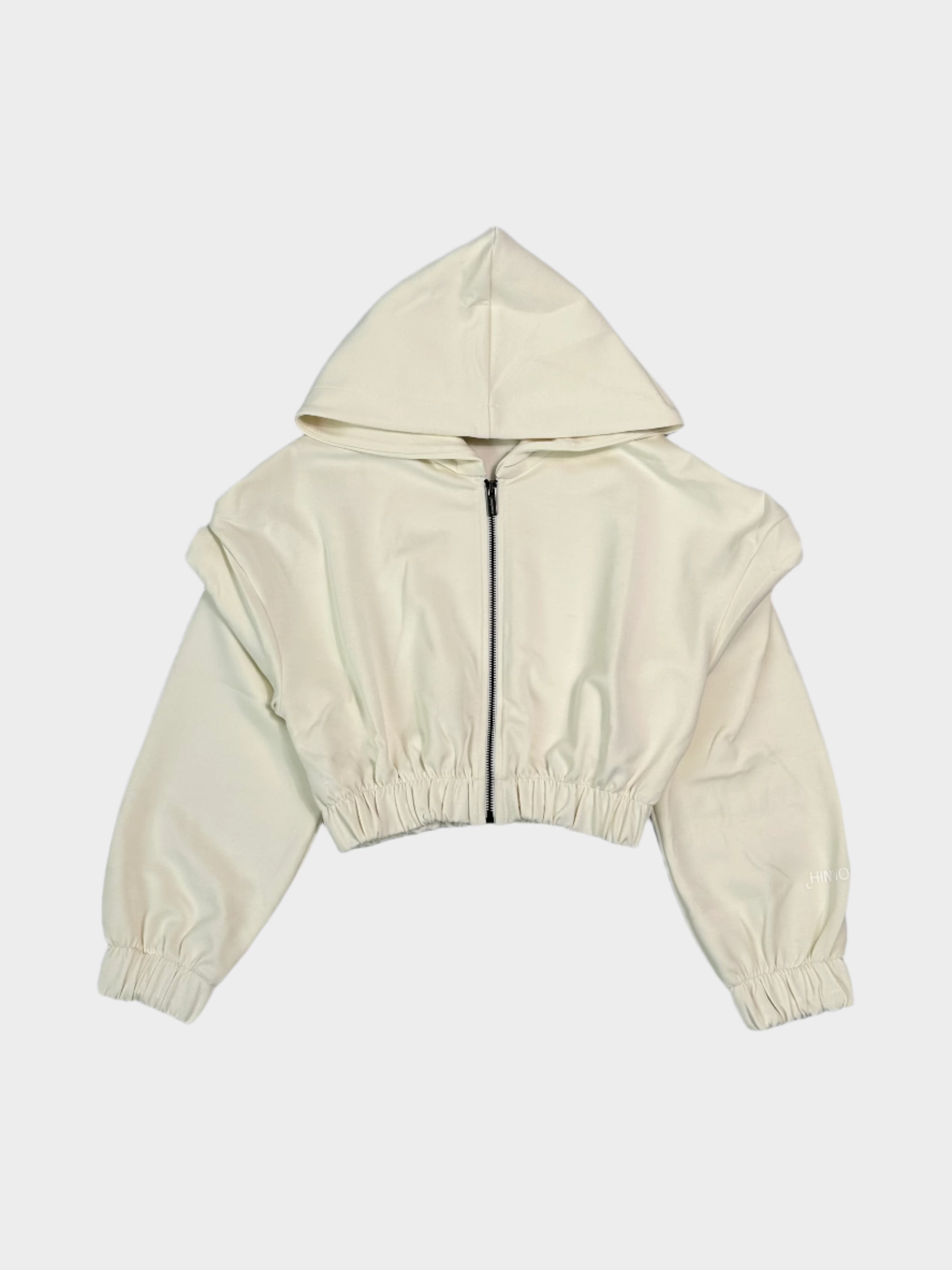Vista frontale della felpa corta Hinnominate off white con zip e cappuccio