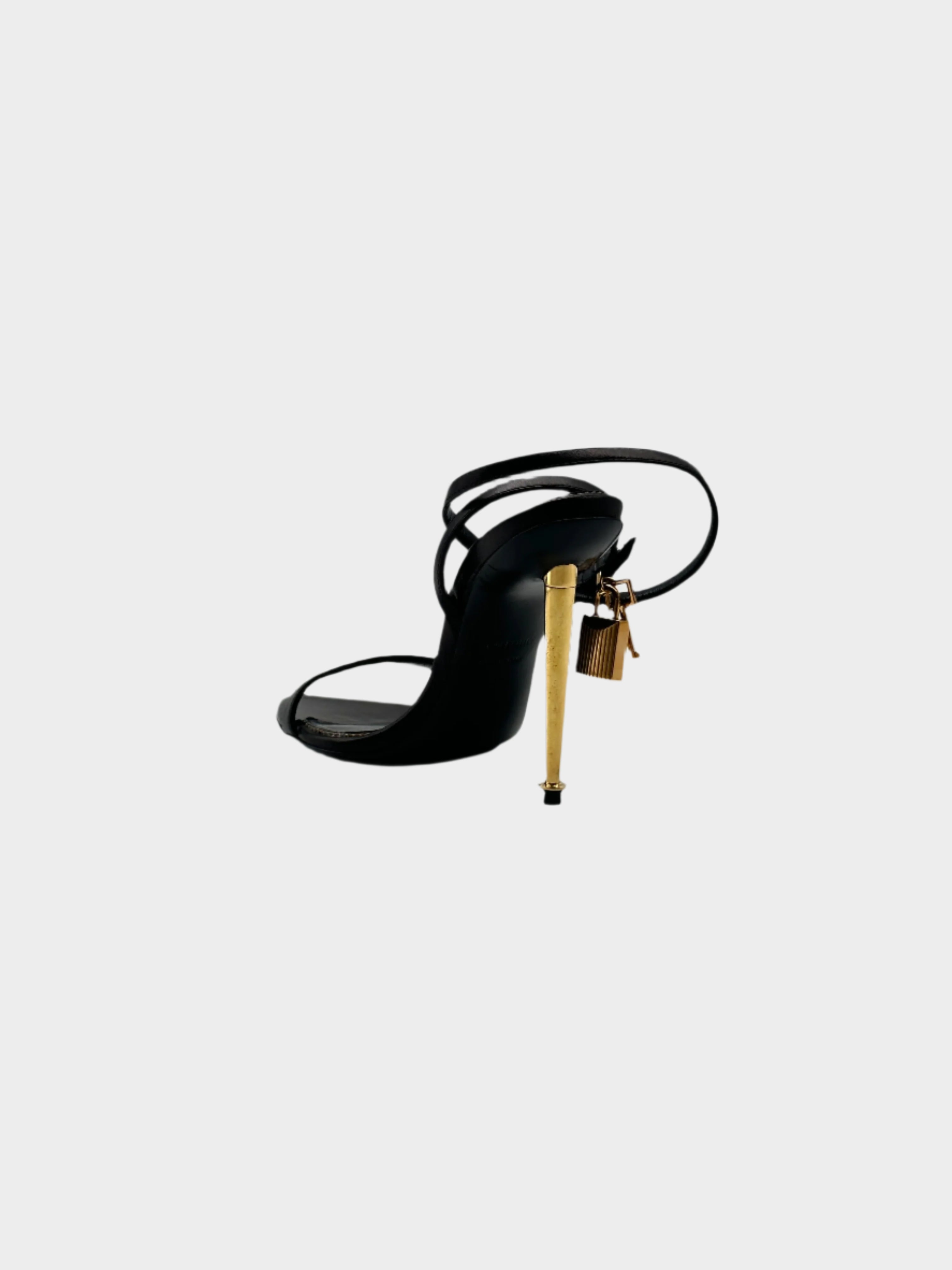 Padlock Heels con punta aperta, cinturino regolabile, lucchetto dorato e tacco a spillo dorato da 9 cm. Eleganza raffinata.