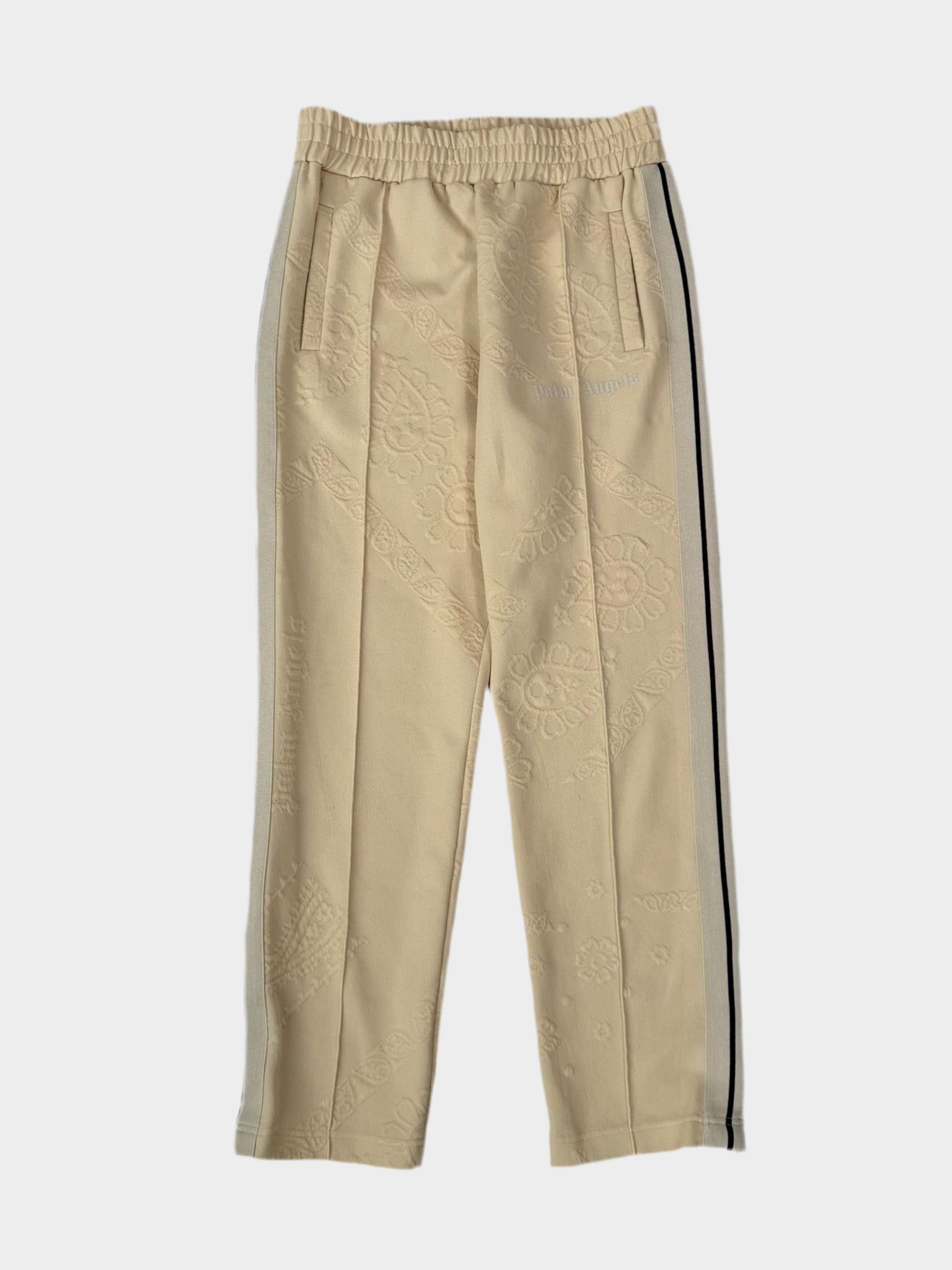 Vista frontale dei pantaloni Palm Angels panna con fantasia a rilievo tono su tono
