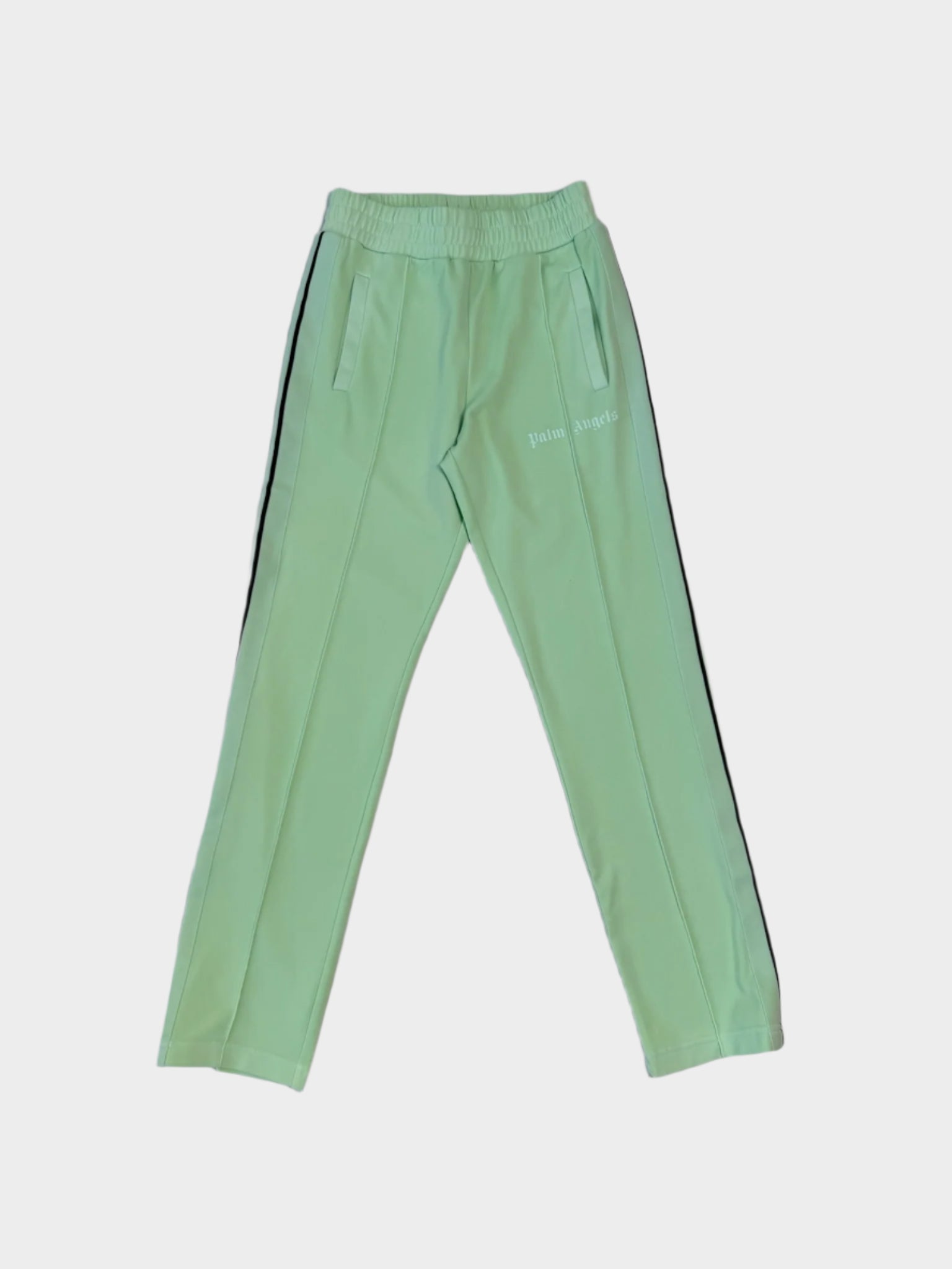Vista frontale dei pantaloni Palm Angels verde fluo con bande nere