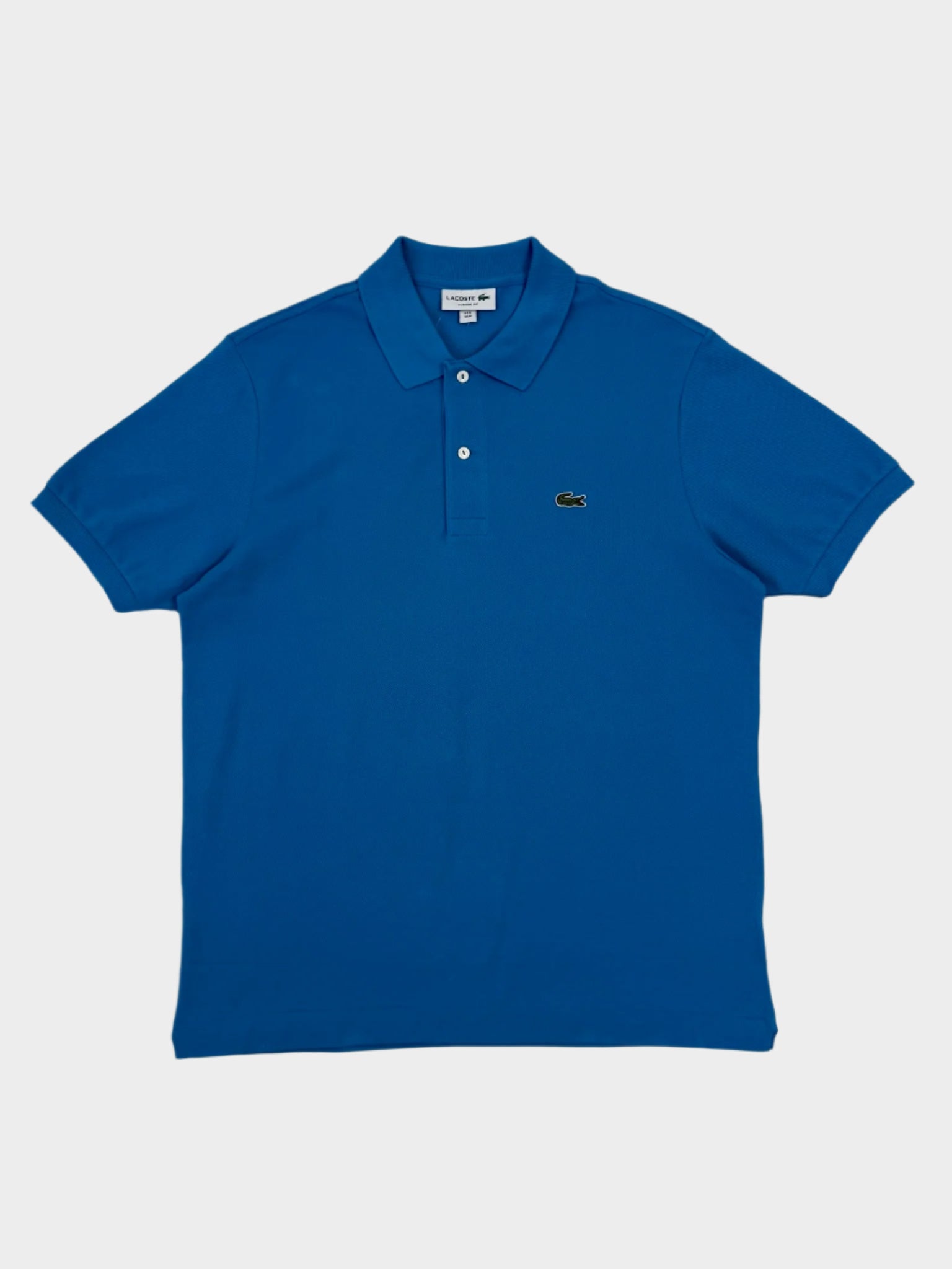polo Lacoste azzurro, polo uomo cotone piqué, Lacoste con logo coccodrillo, polo classica azzurro, polo Lacoste tinta unita