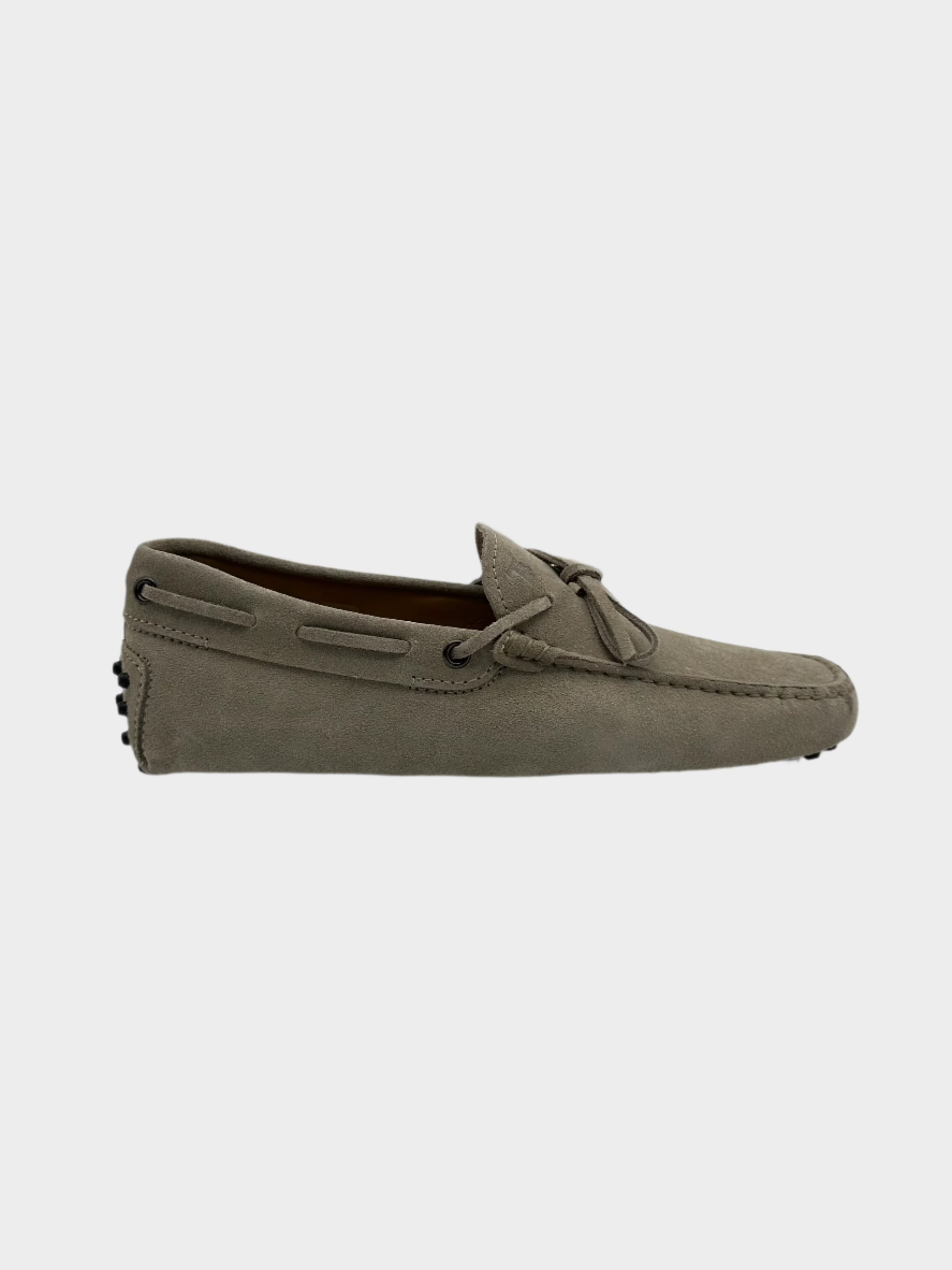 Mocassino Tod's in pelle scamosciata sabbia con laccetto e suola a gommini, vista laterale